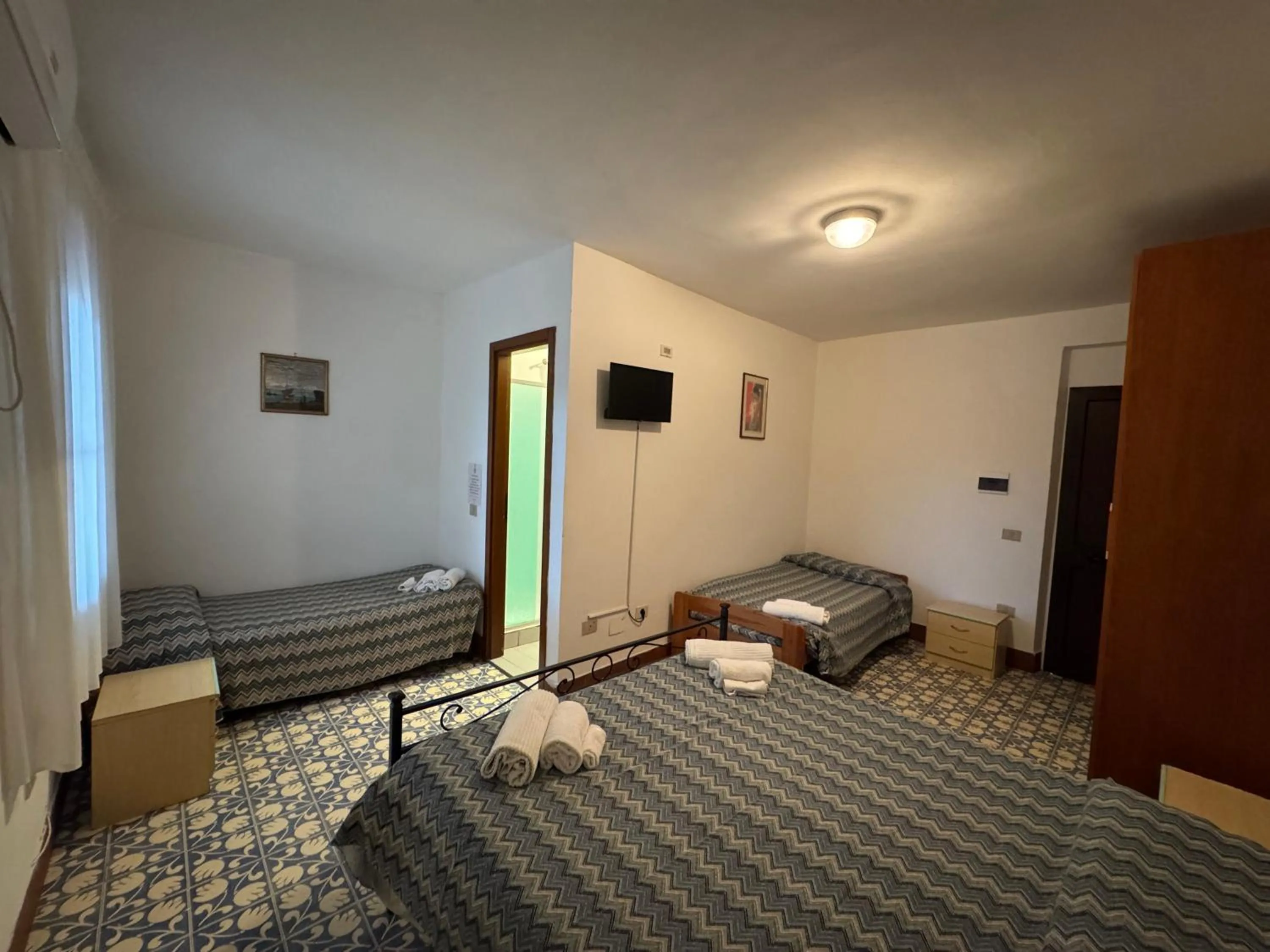 Bed in Hotel Paradiso