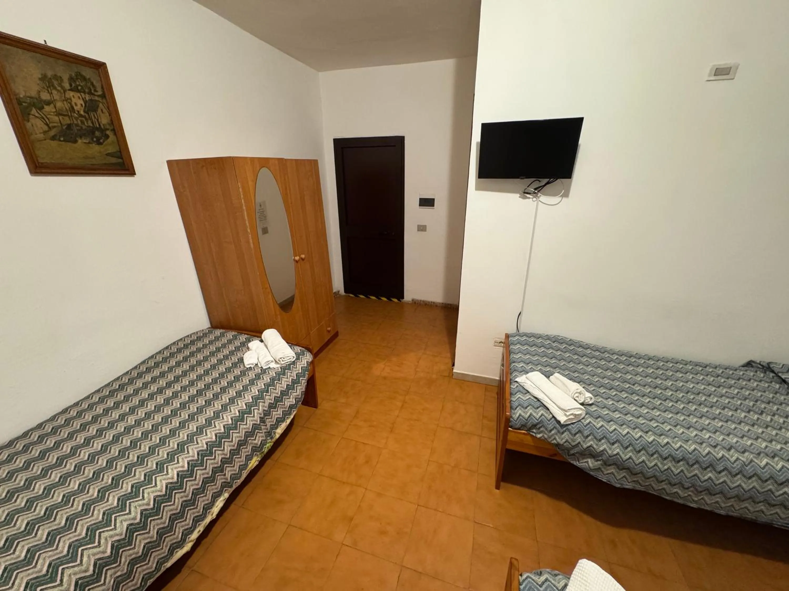 Bed in Hotel Paradiso