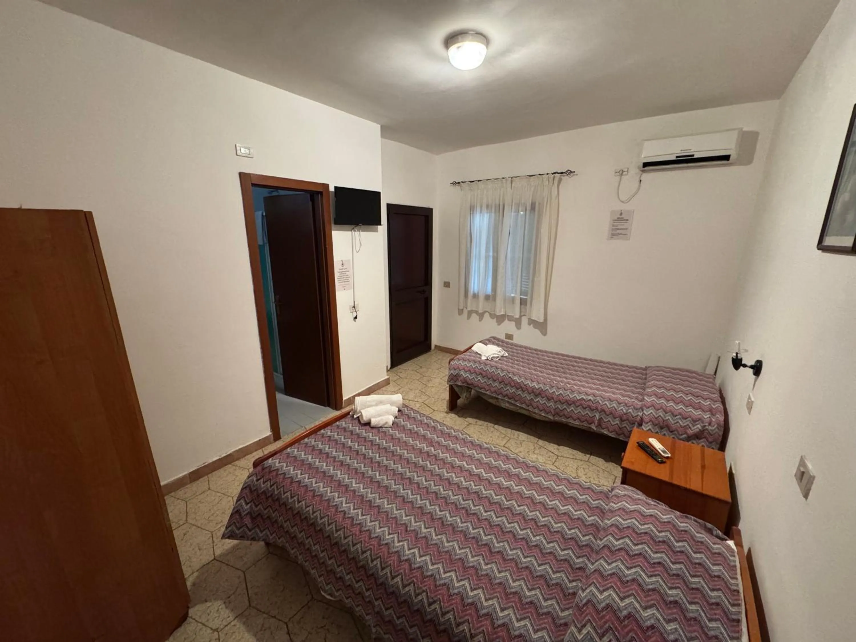 Bed in Hotel Paradiso