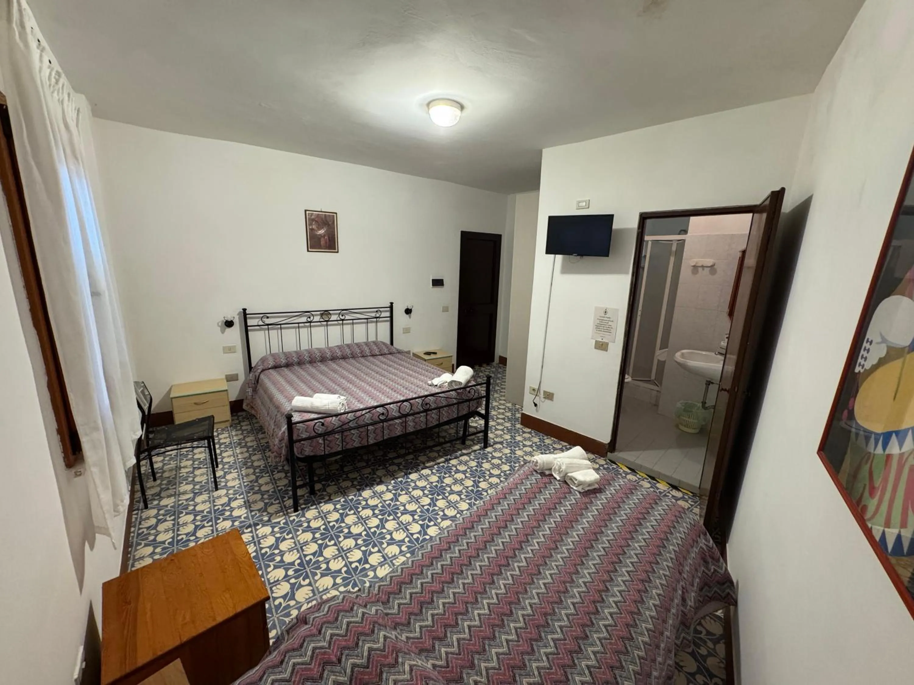 Bed in Hotel Paradiso