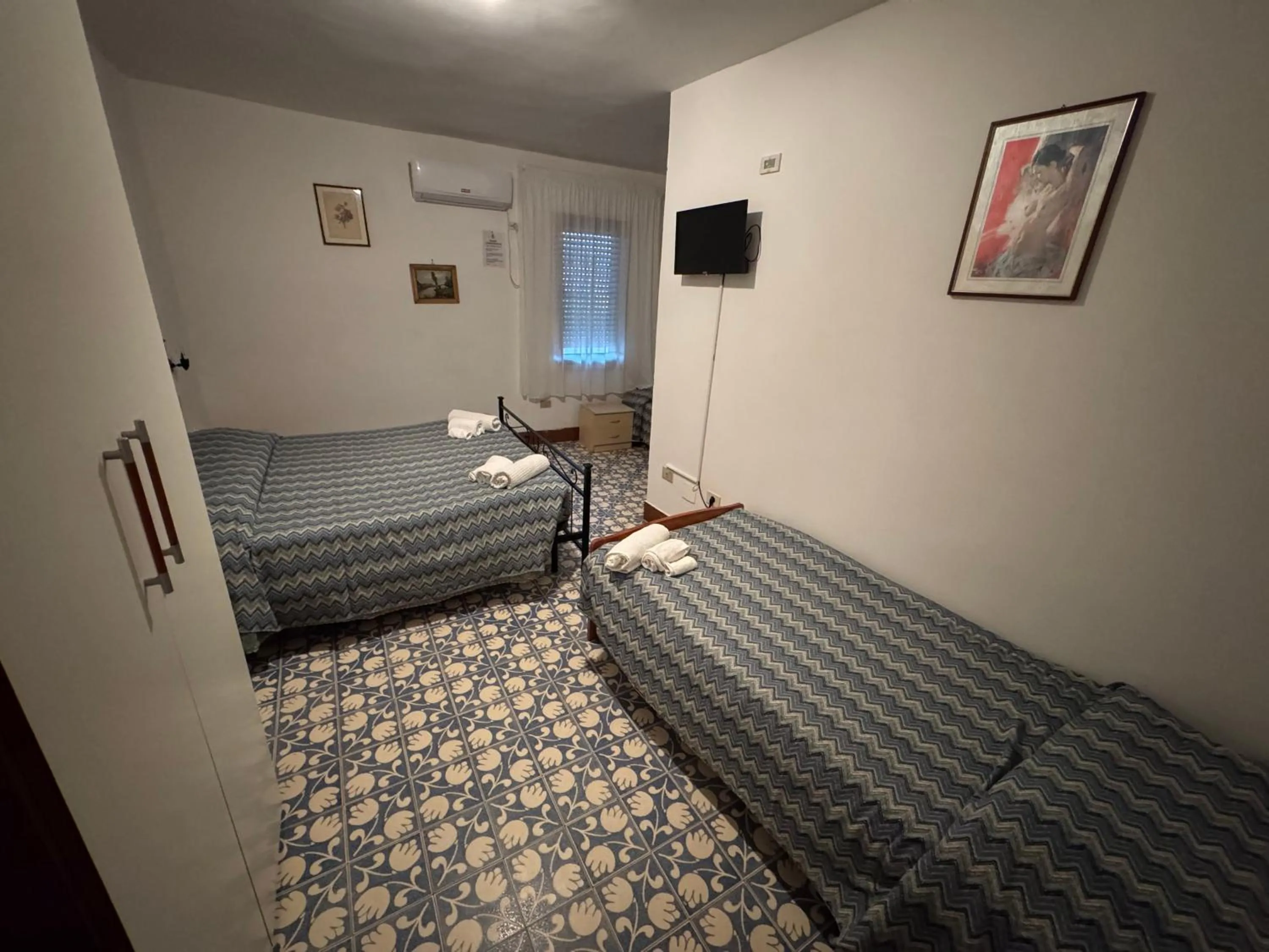 Bed in Hotel Paradiso