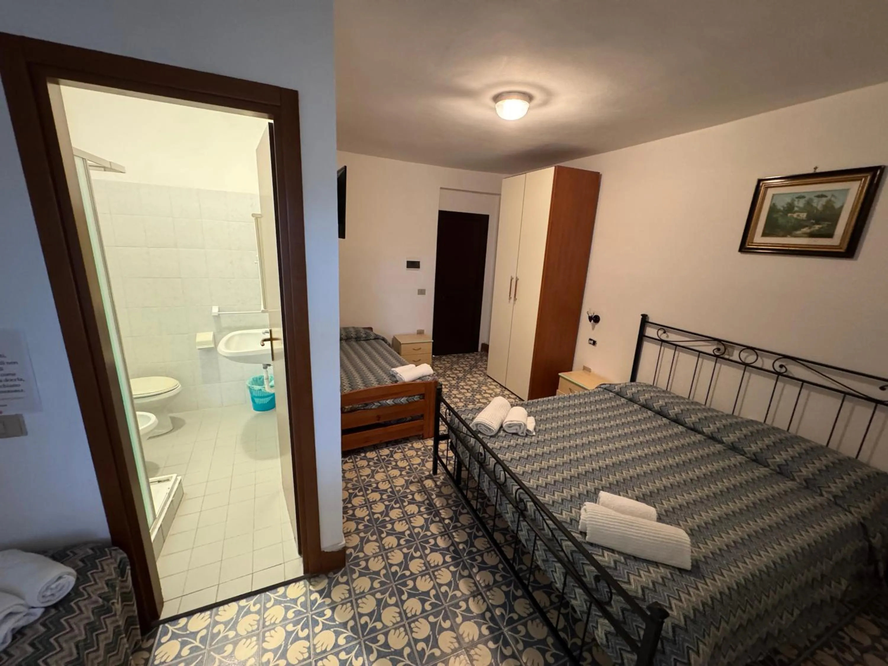 Bed in Hotel Paradiso