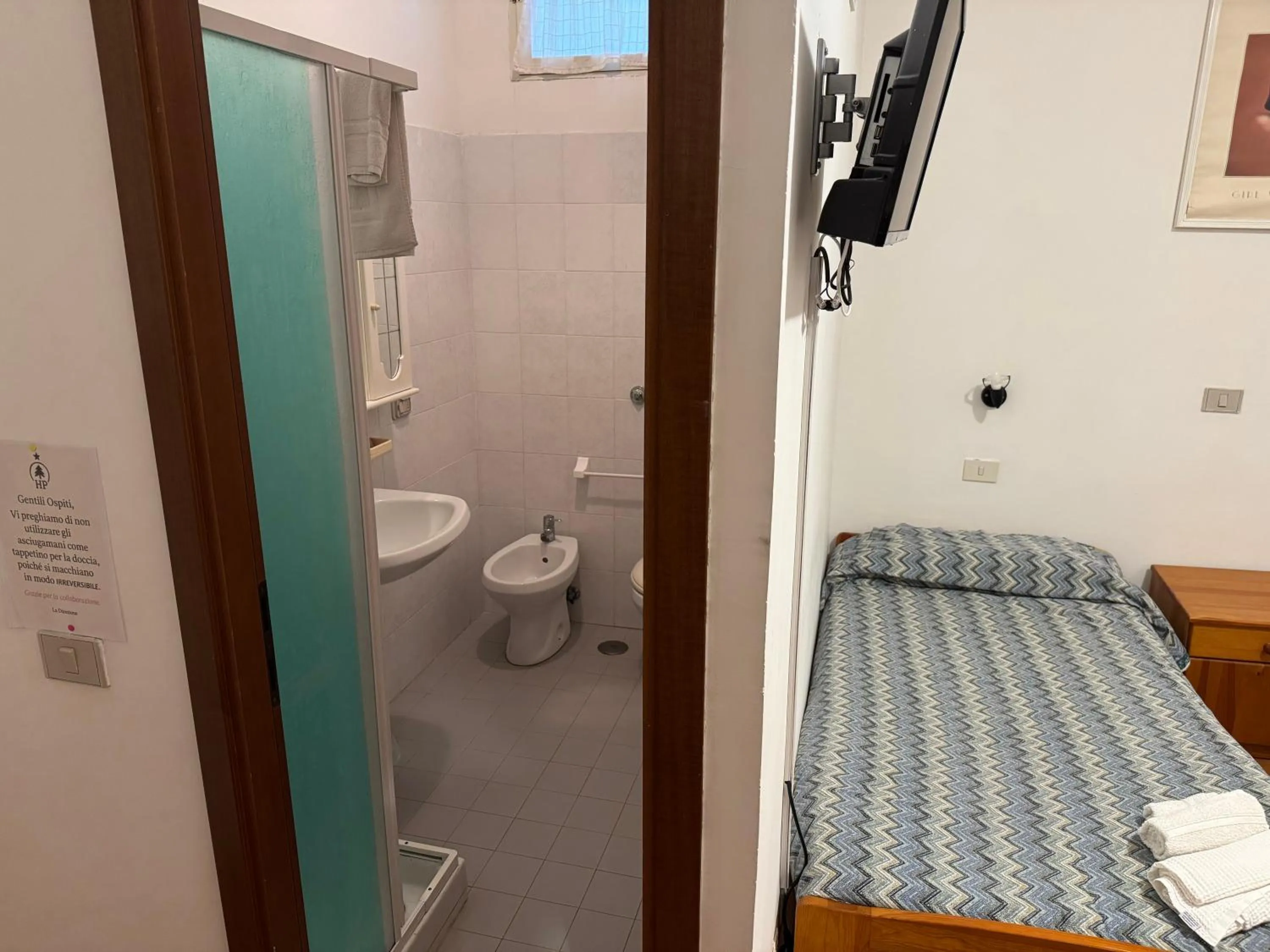 Bed in Hotel Paradiso