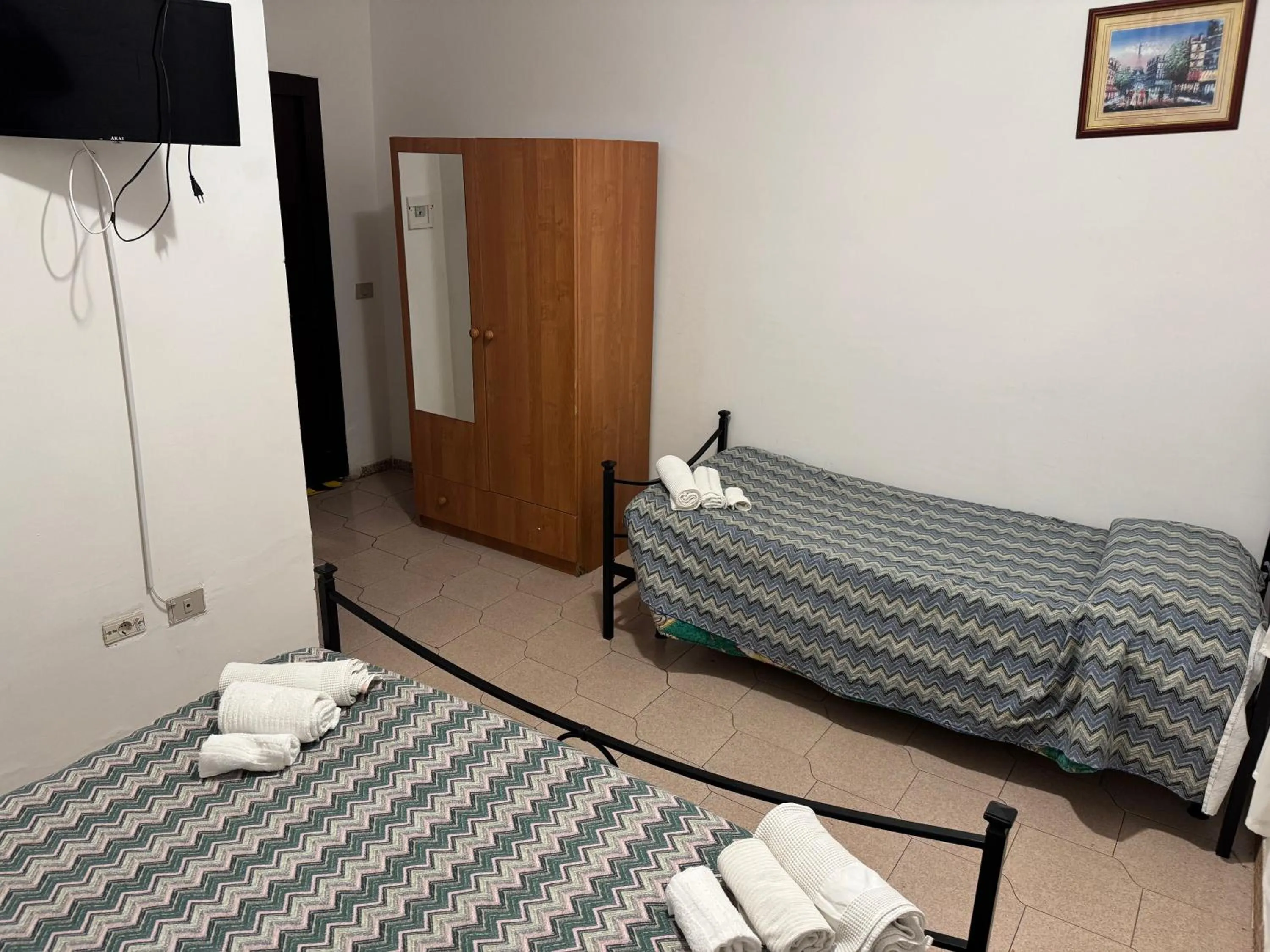 Bed in Hotel Paradiso