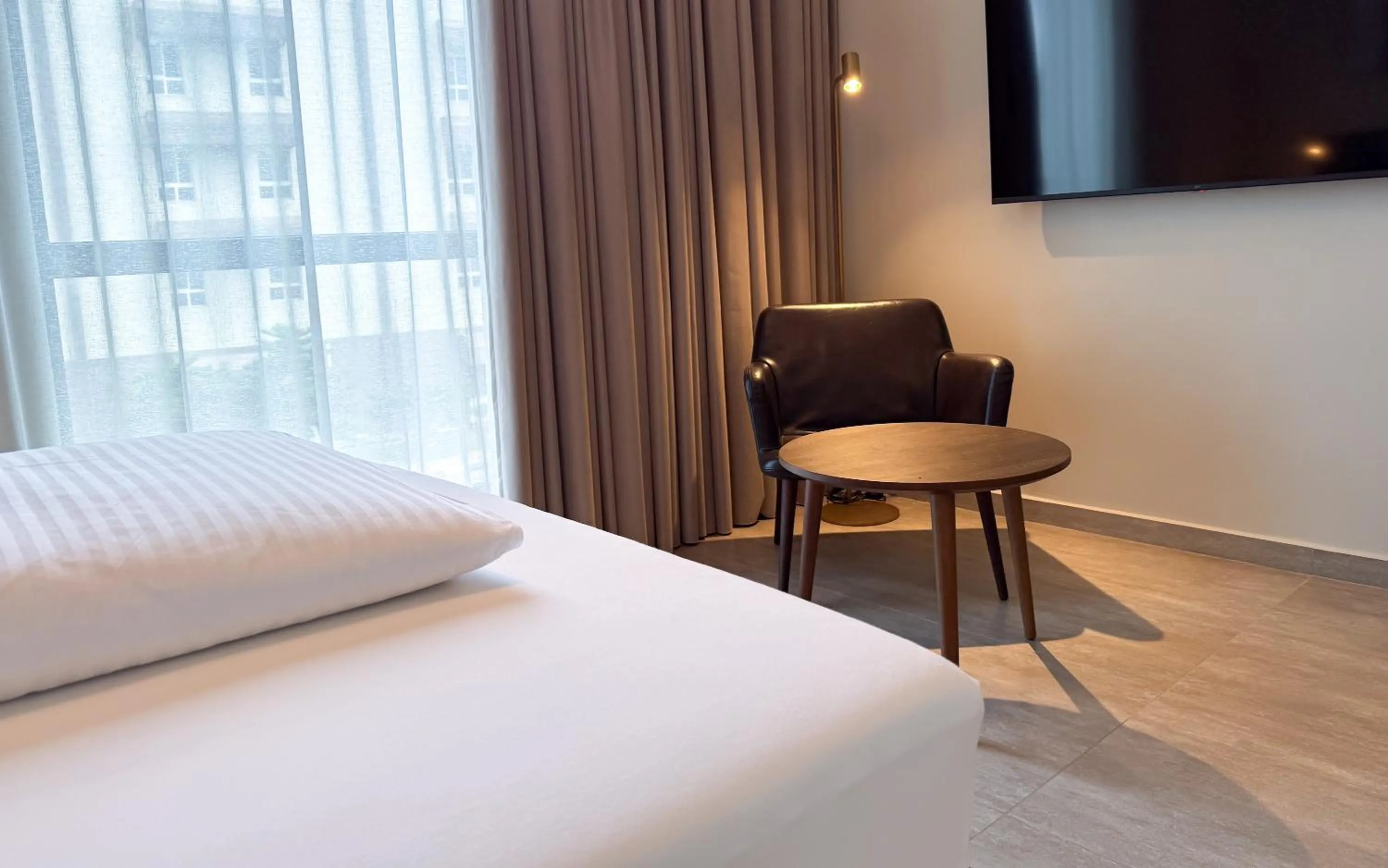 Seating area, Bed in The Nordic Abuja