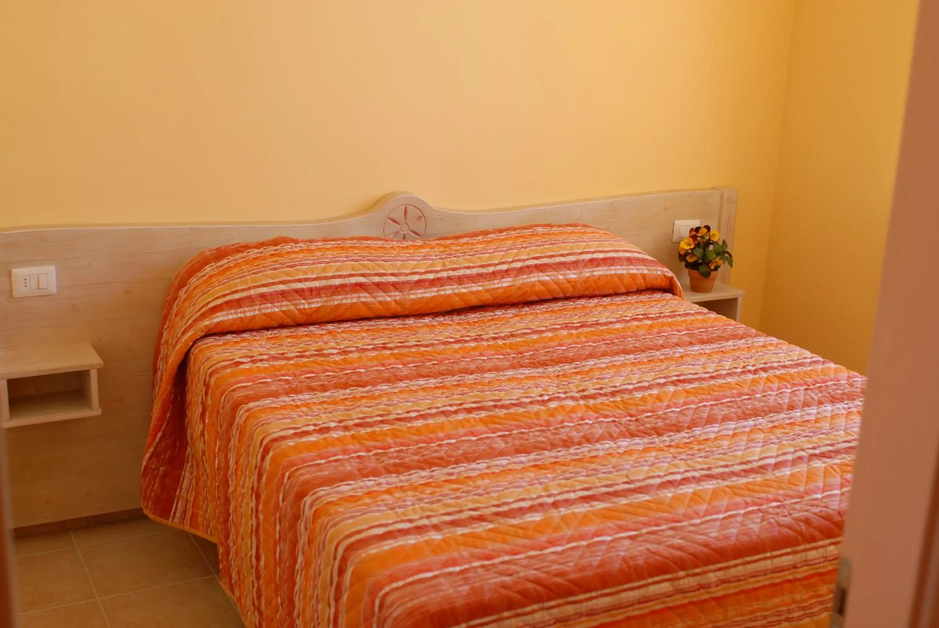 Bed in Le Nereidi Hotel & Residence