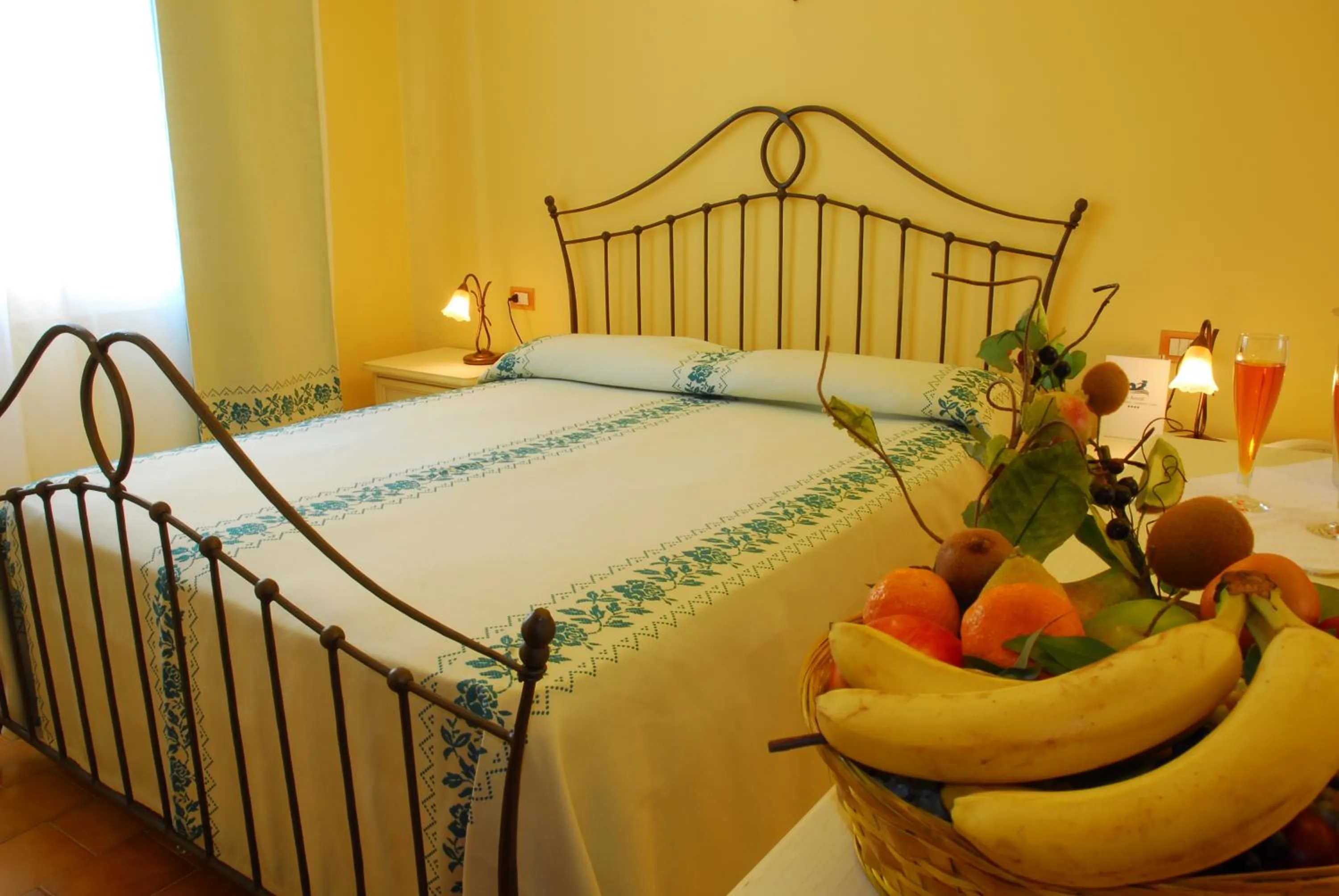 Bed in Le Nereidi Hotel & Residence