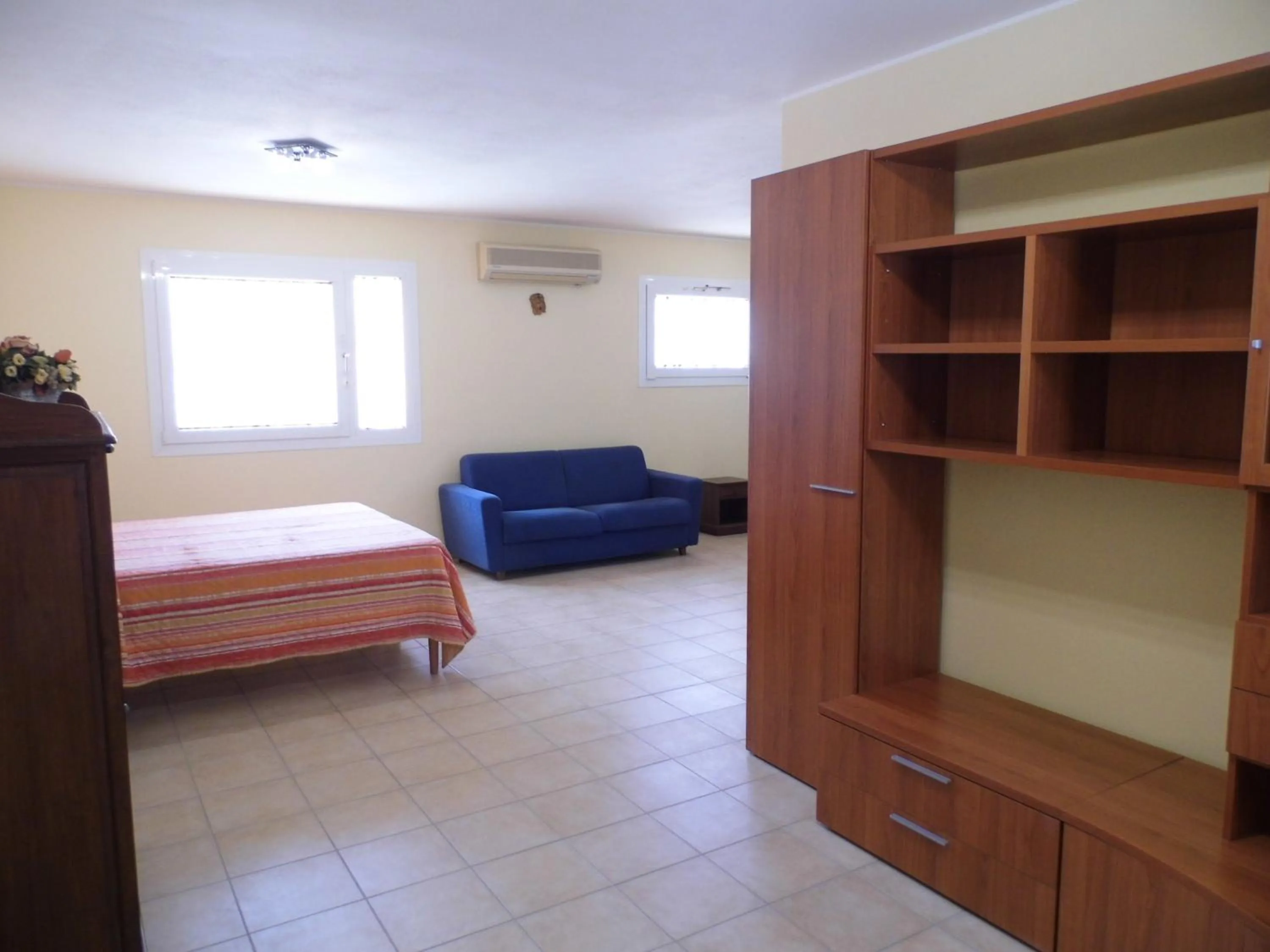 Living room, Bed in Le Nereidi Hotel & Residence