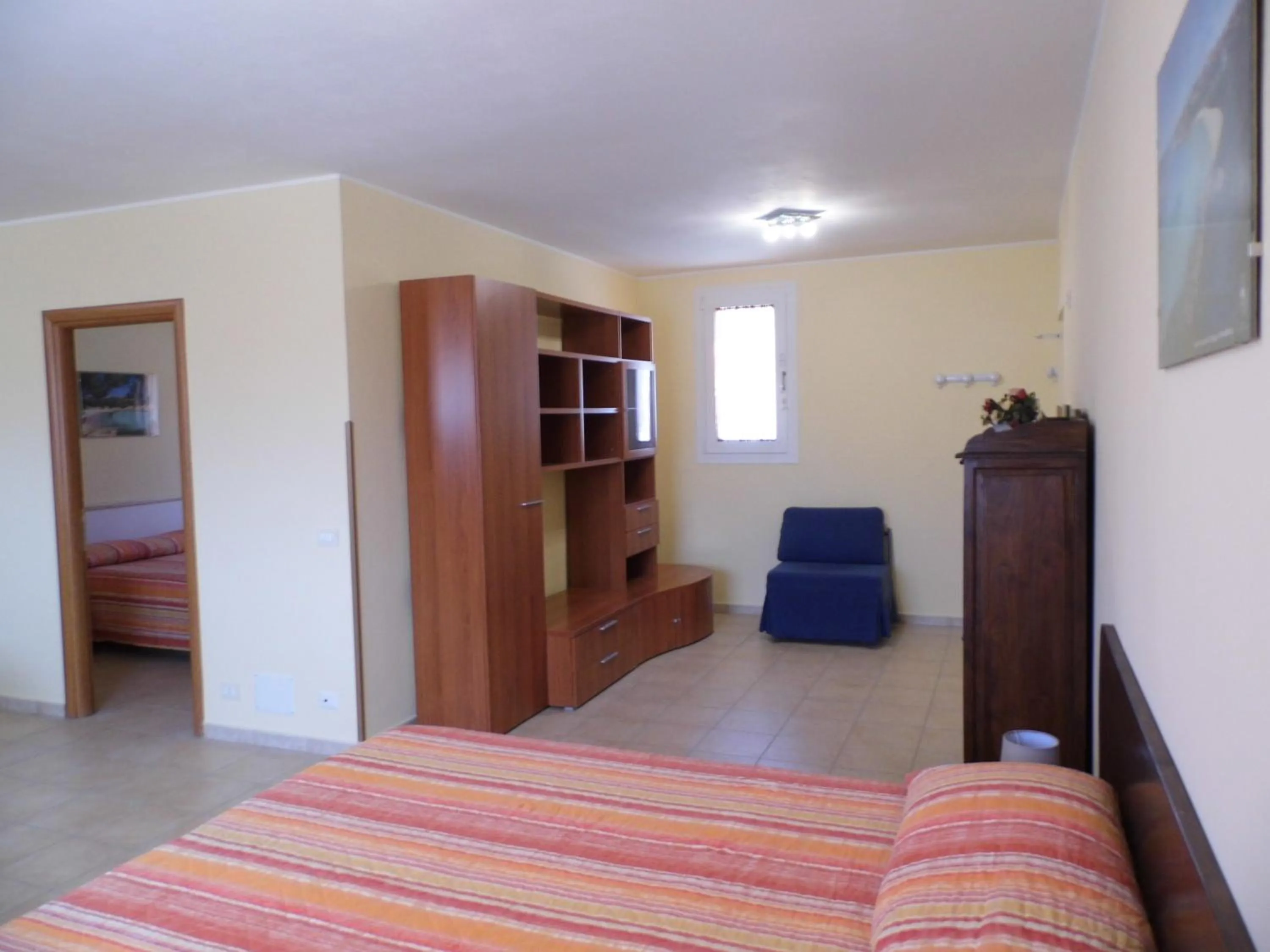 Living room, Bed in Le Nereidi Hotel & Residence