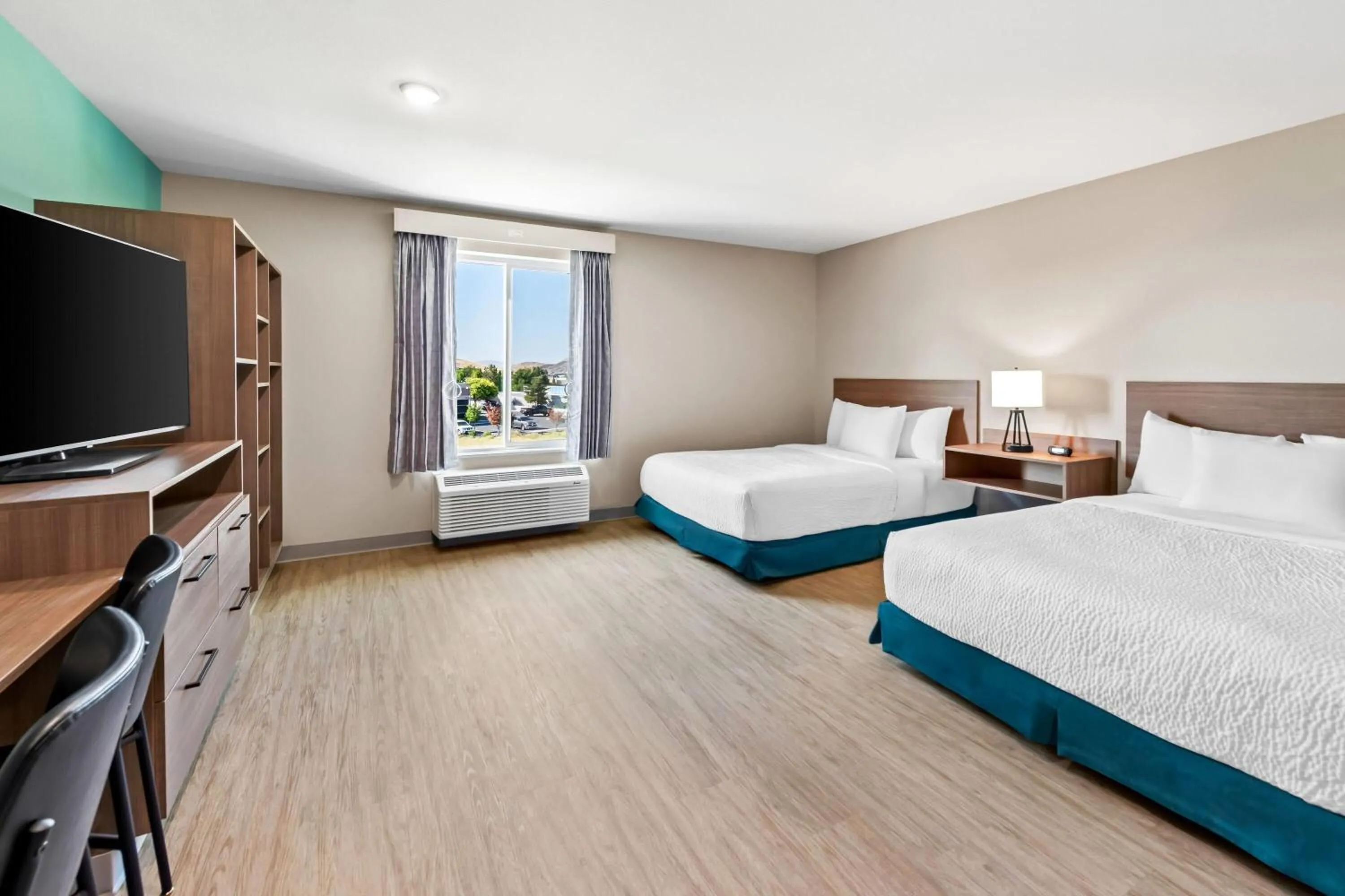 Bed in ECHO Suites Extended Stay by Wyndham Reno