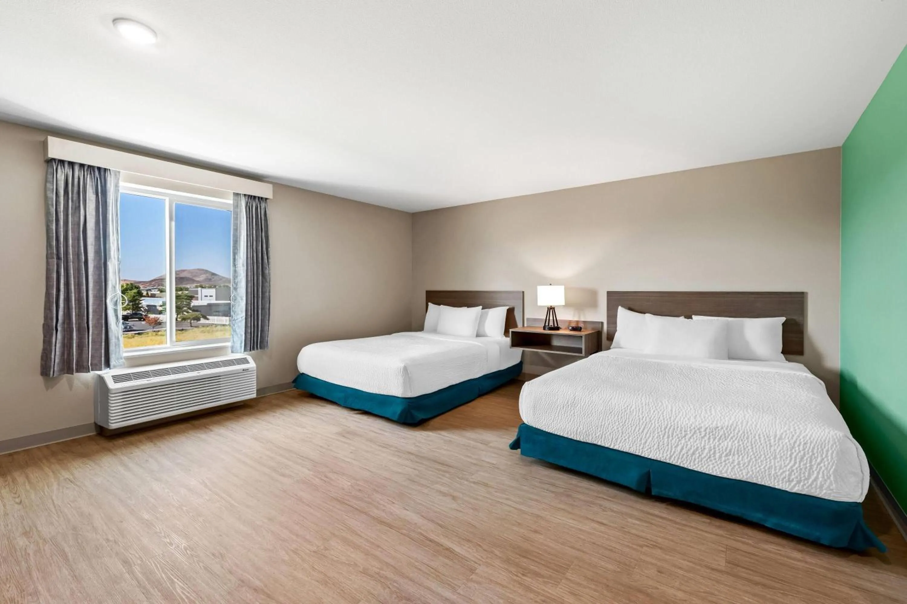 Bed in ECHO Suites Extended Stay by Wyndham Reno