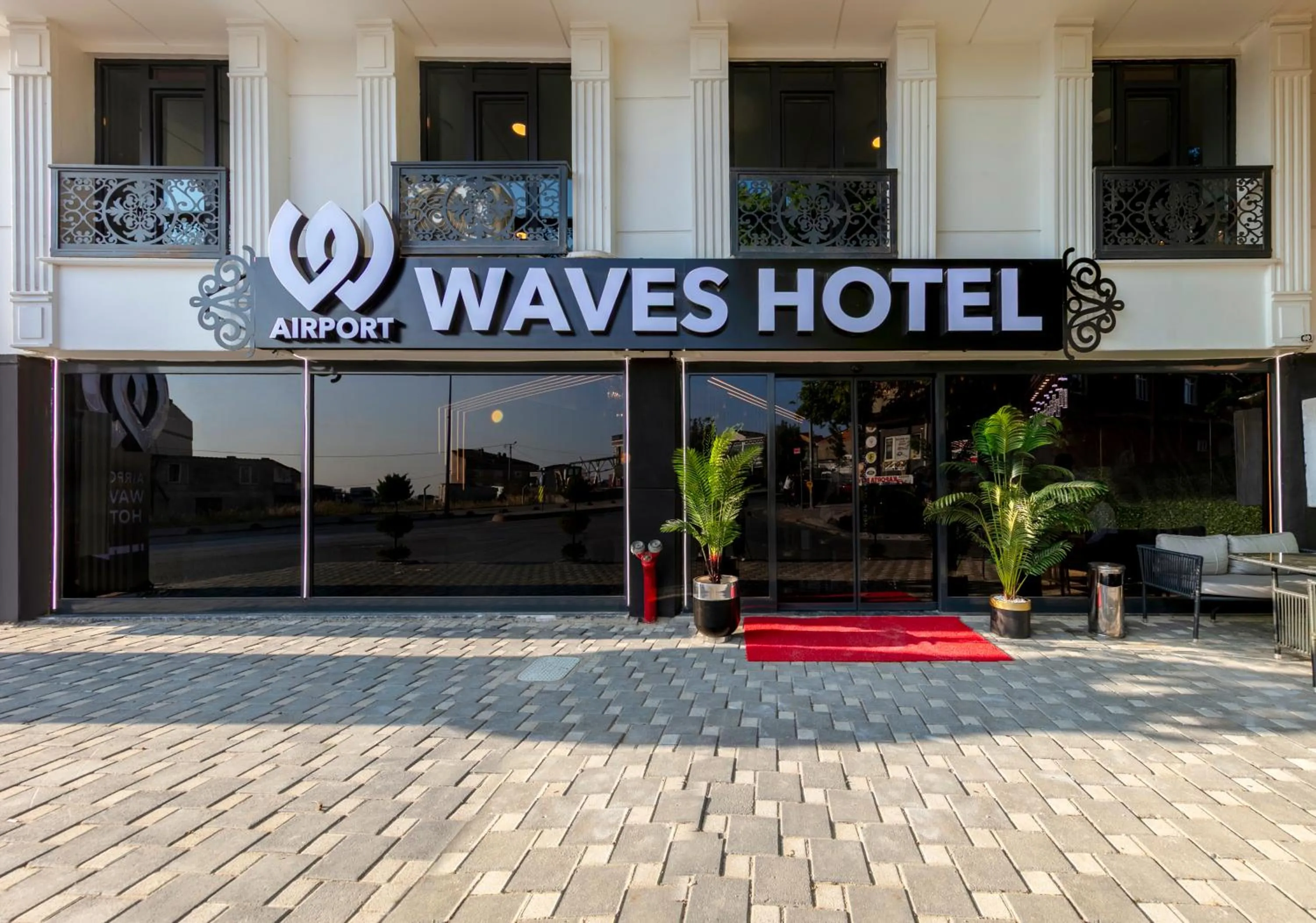 Property logo or sign in Airport Waves Hotel