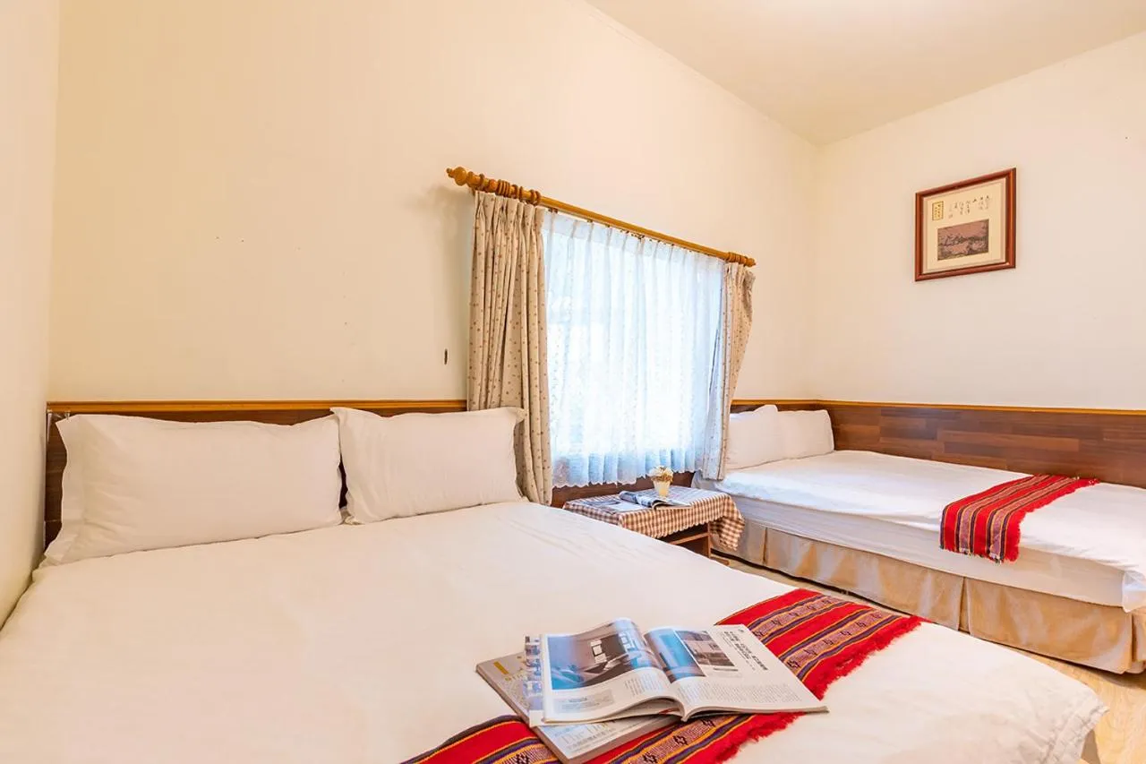 Bed in Yishin Garden B&B