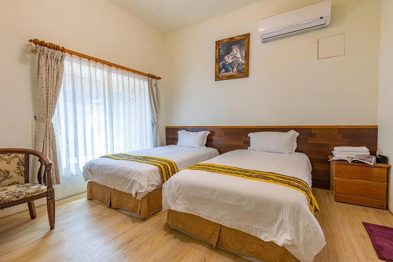 Bed in Yishin Garden B&B