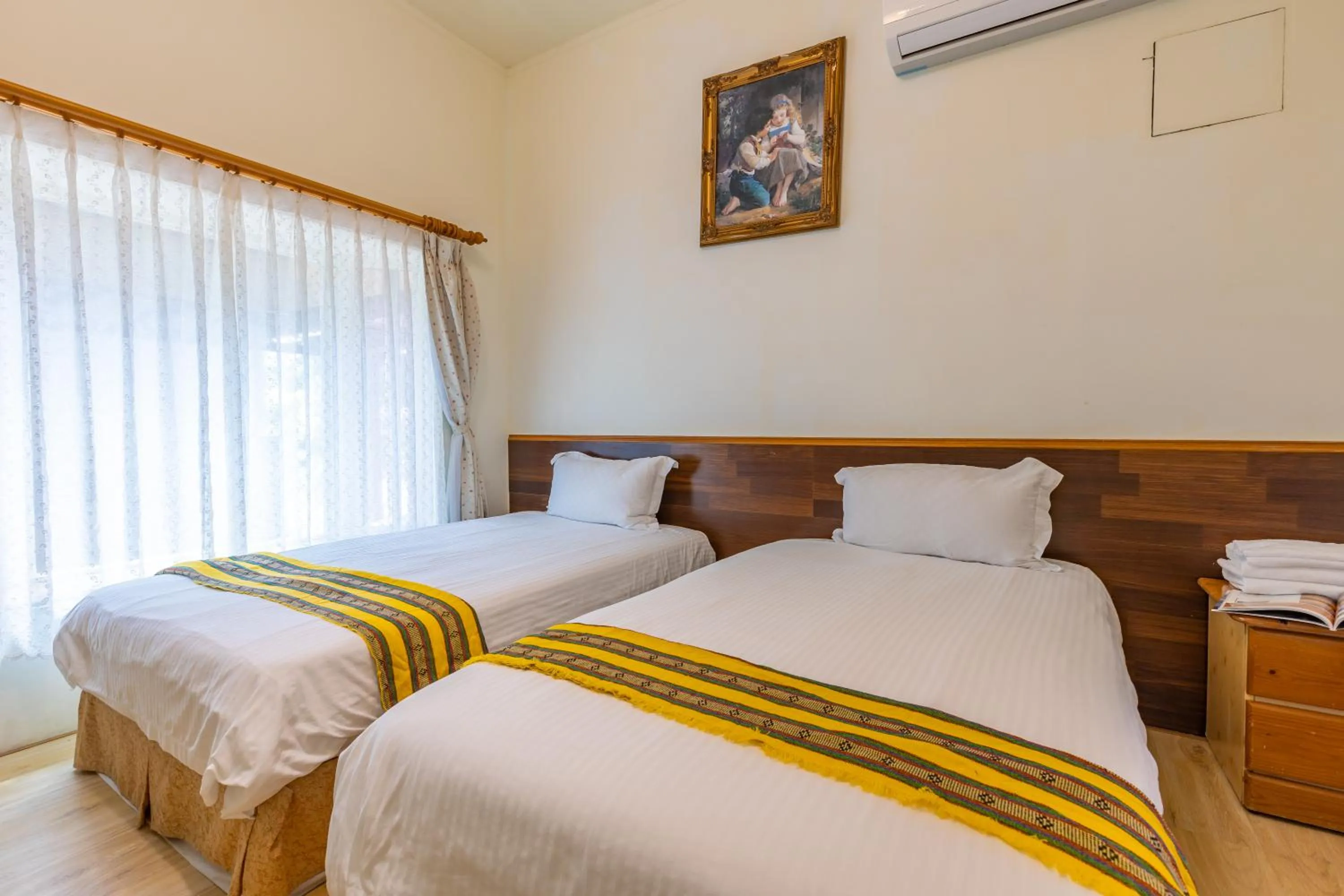 Bed in Yishin Garden B&B