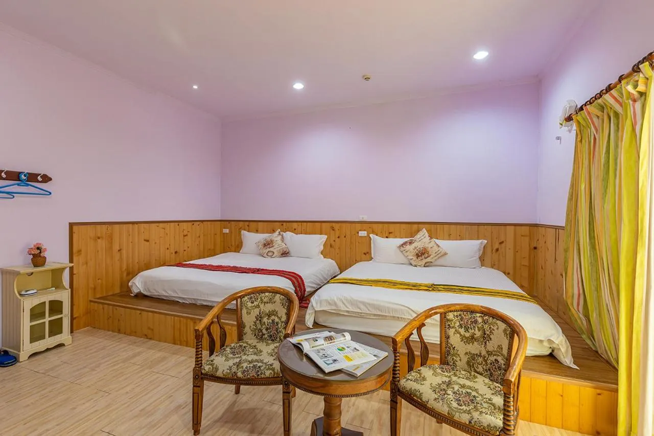 Bed in Yishin Garden B&B