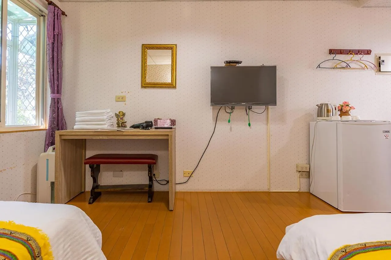 Bed in Yishin Garden B&B