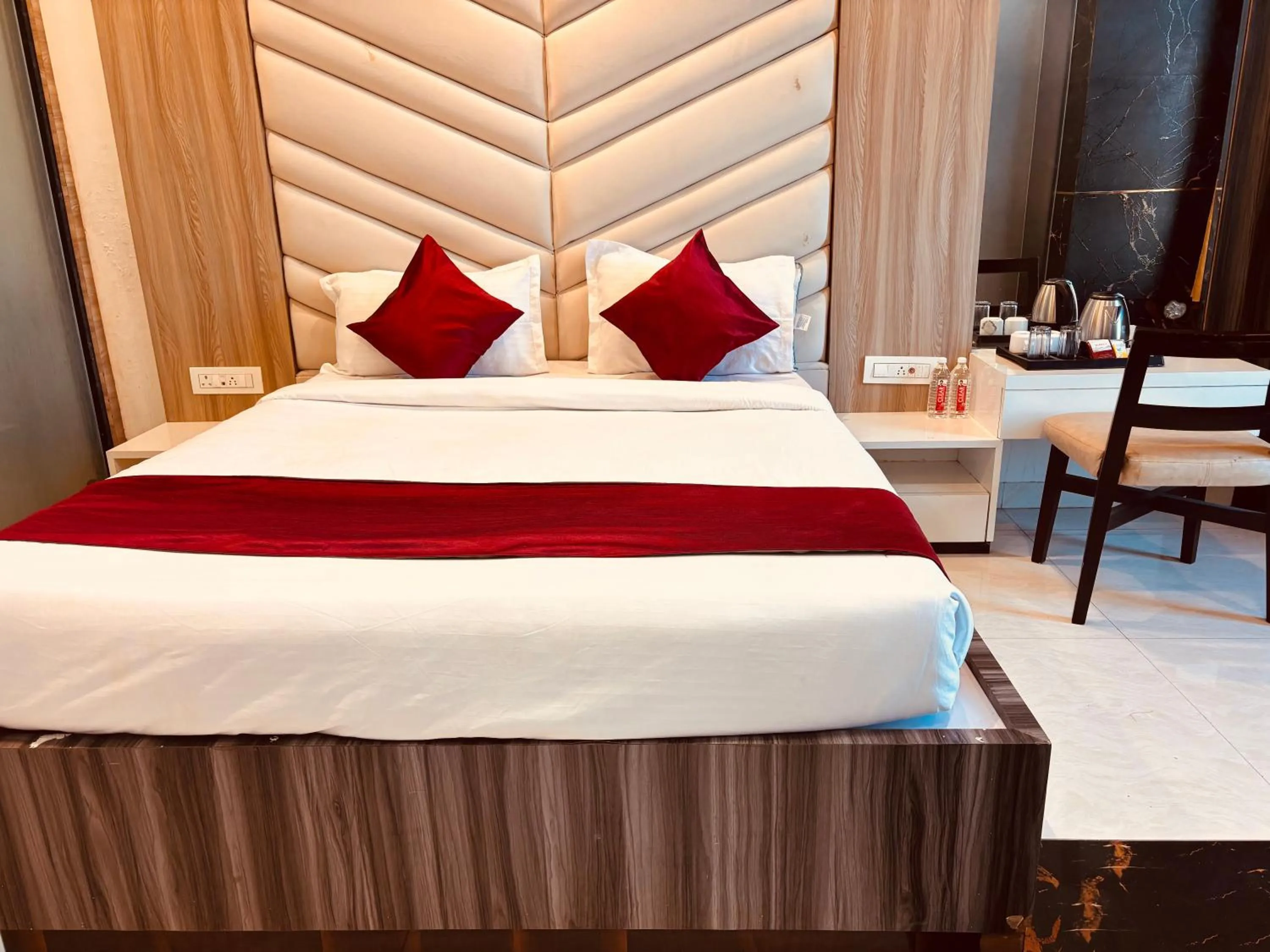 Bed in Hotel Chariot Inn