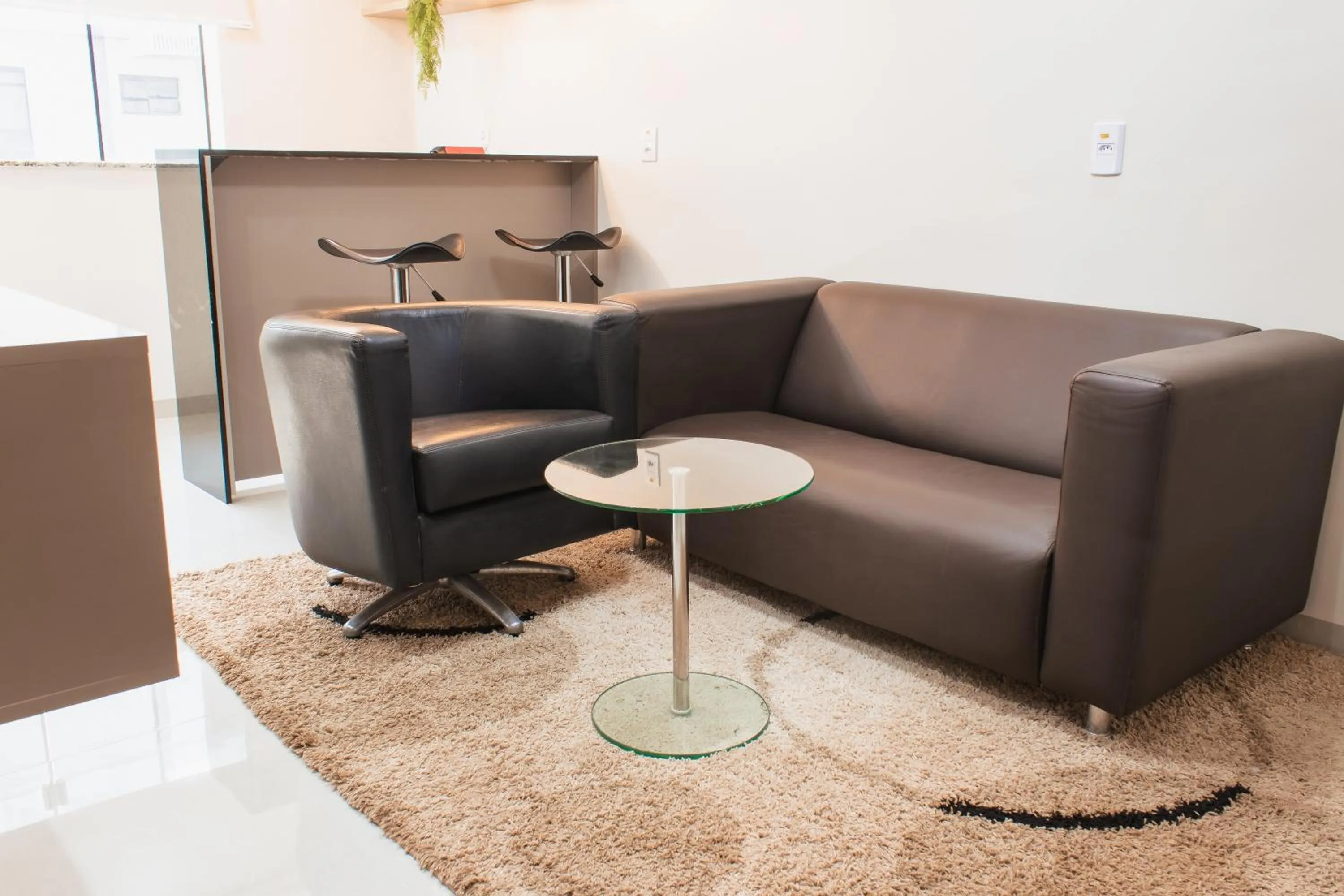 Seating area in Atrium Confort Hotels
