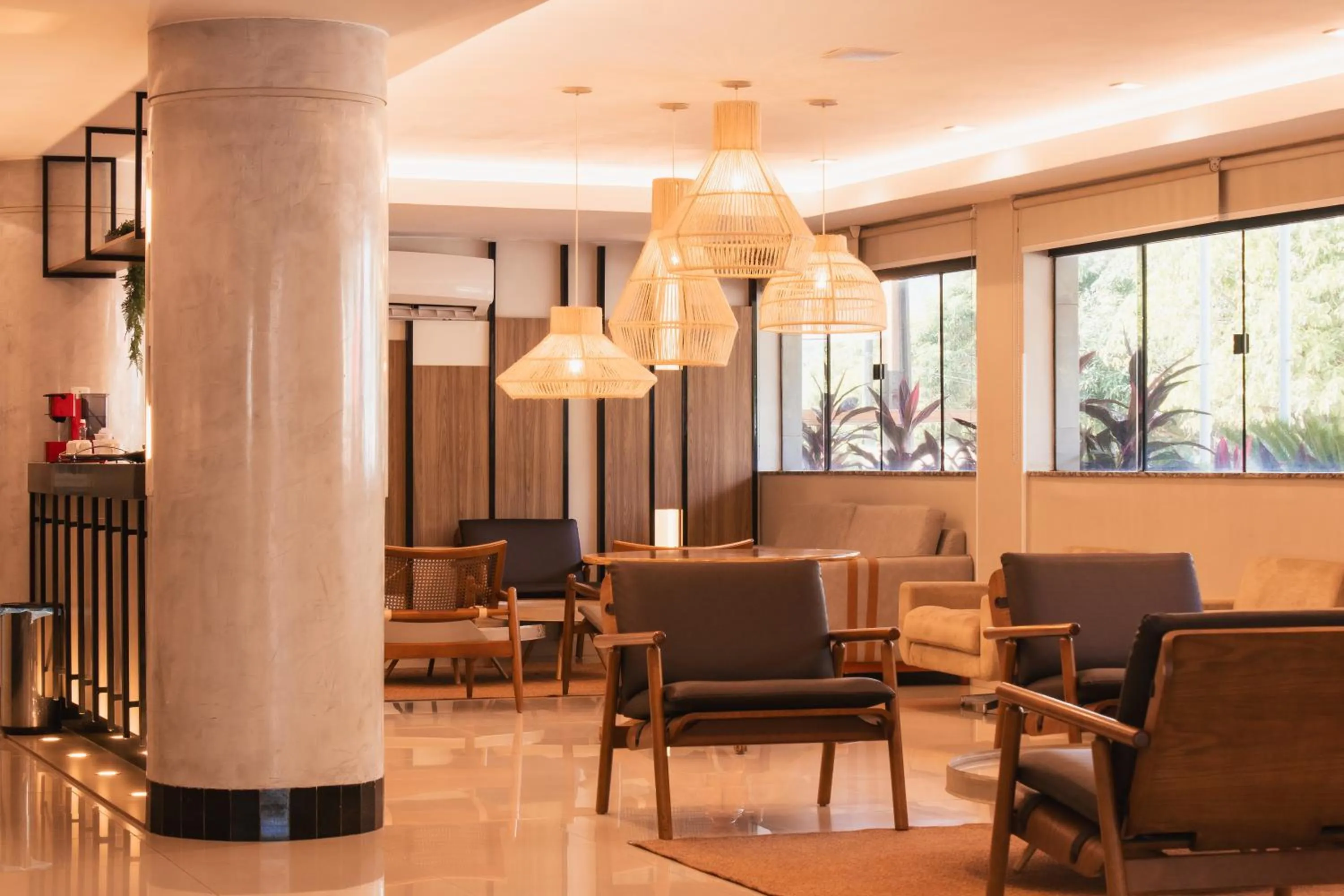 Seating area in Atrium Confort Hotels