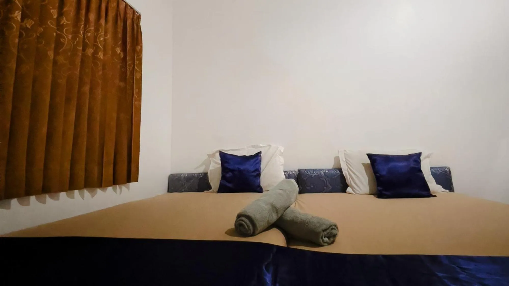 Bed in NamRoom at Tomang