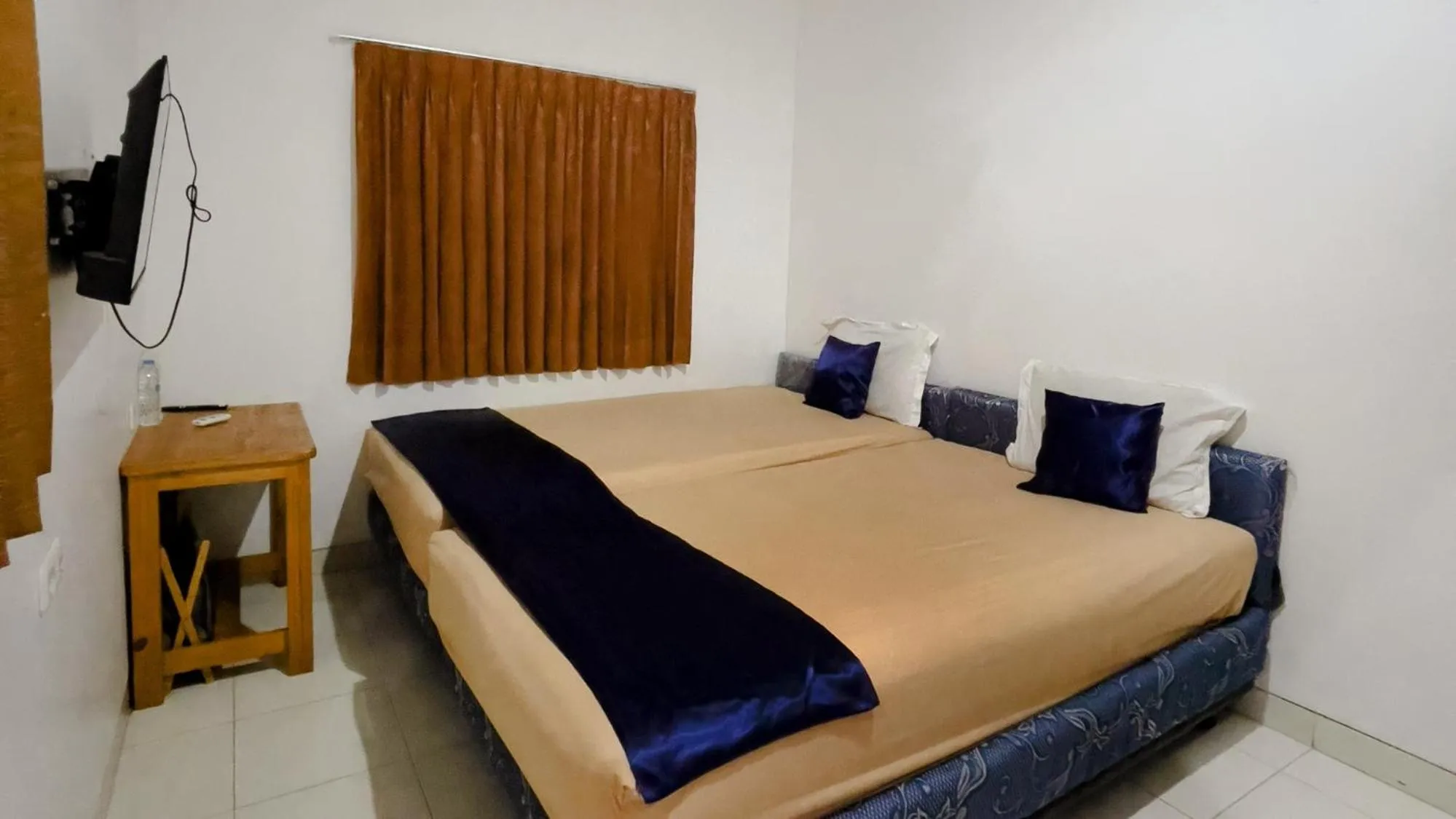 Bed in NamRoom at Tomang