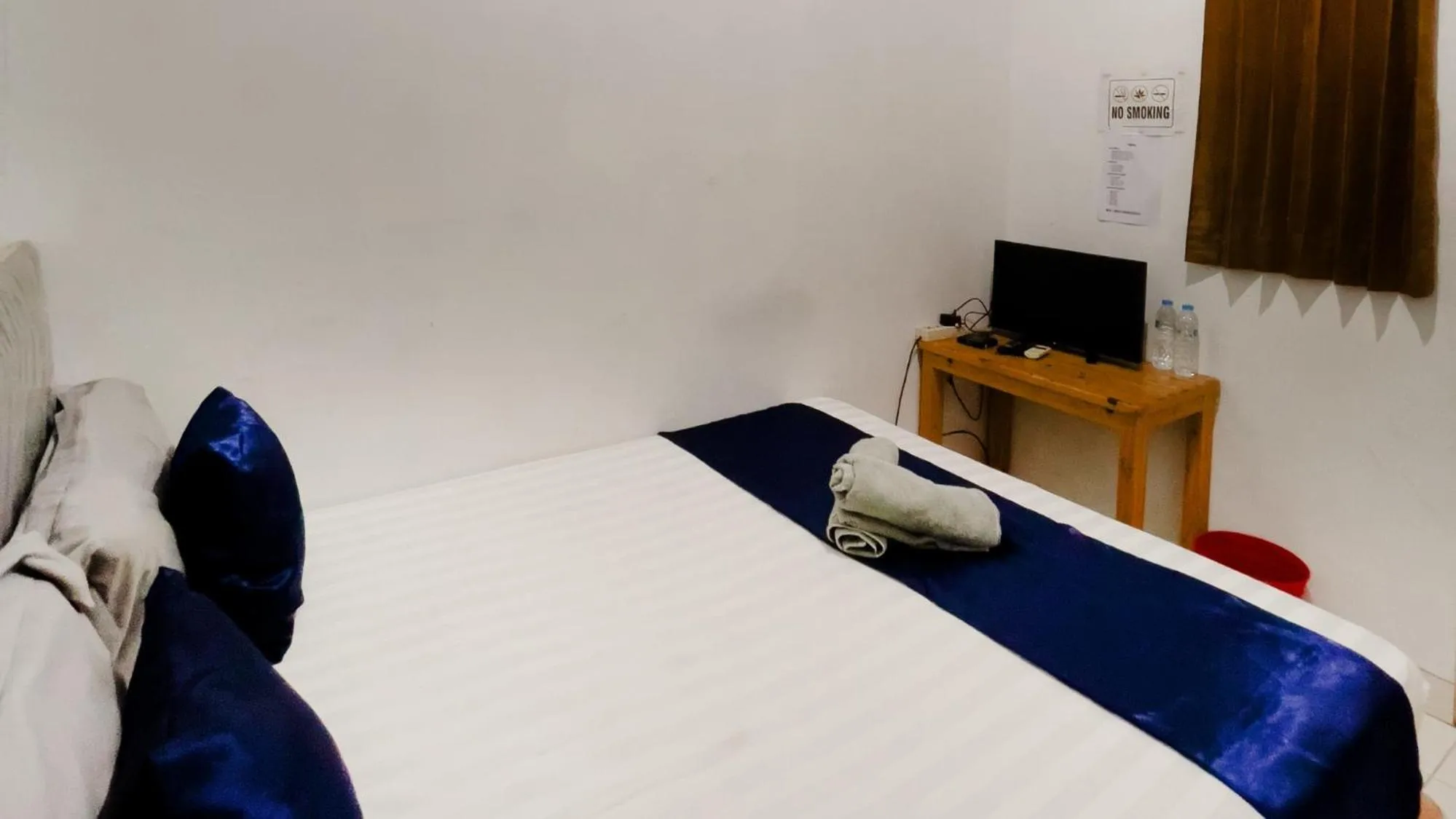 Bed in NamRoom at Tomang