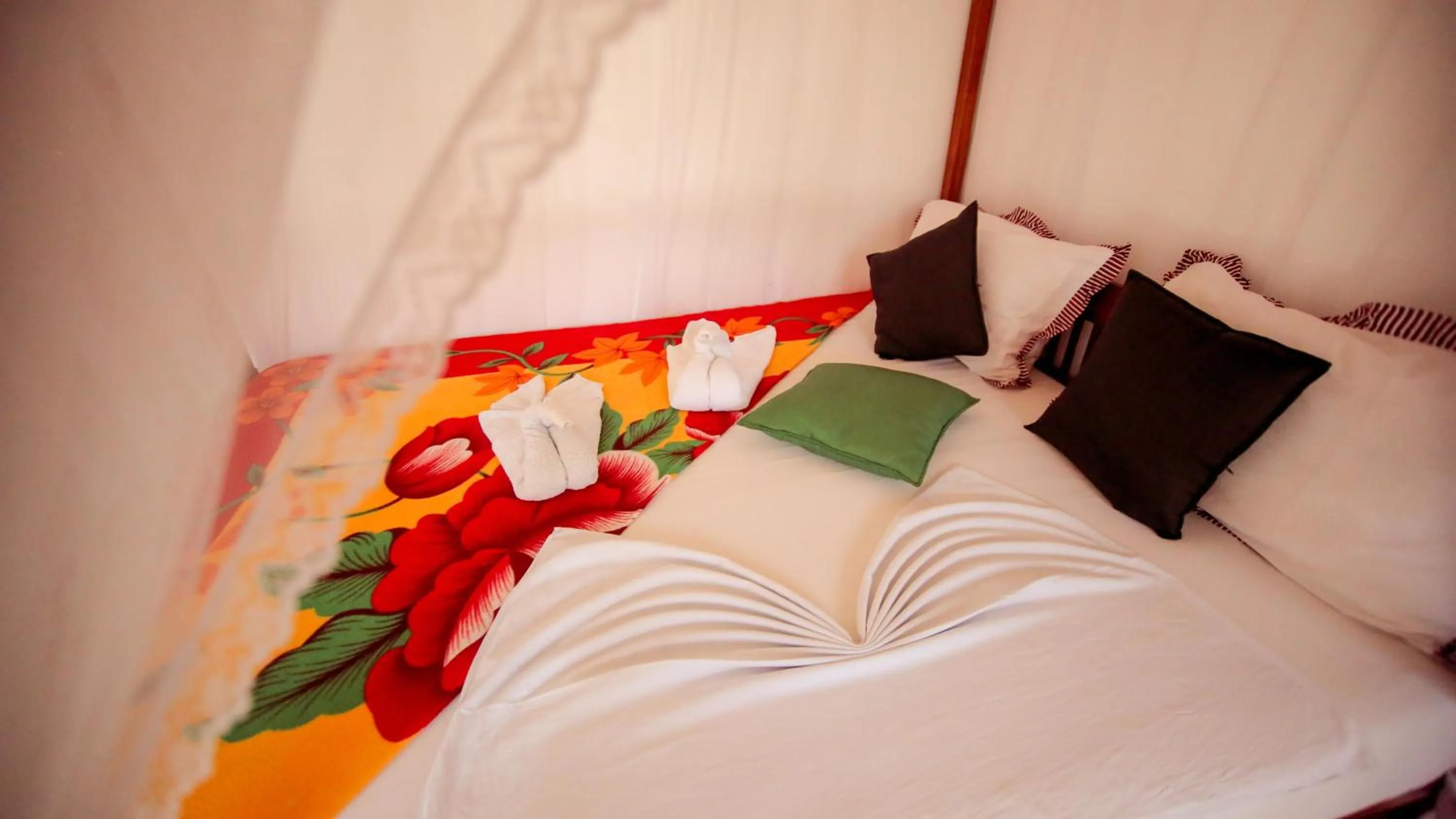 Bedroom in The Frangipani motel
