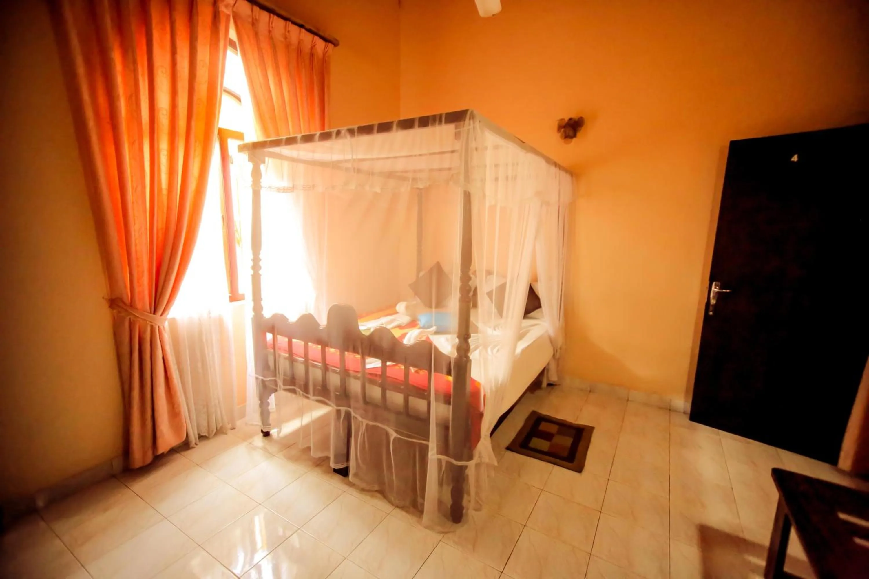 Bedroom in The Frangipani motel