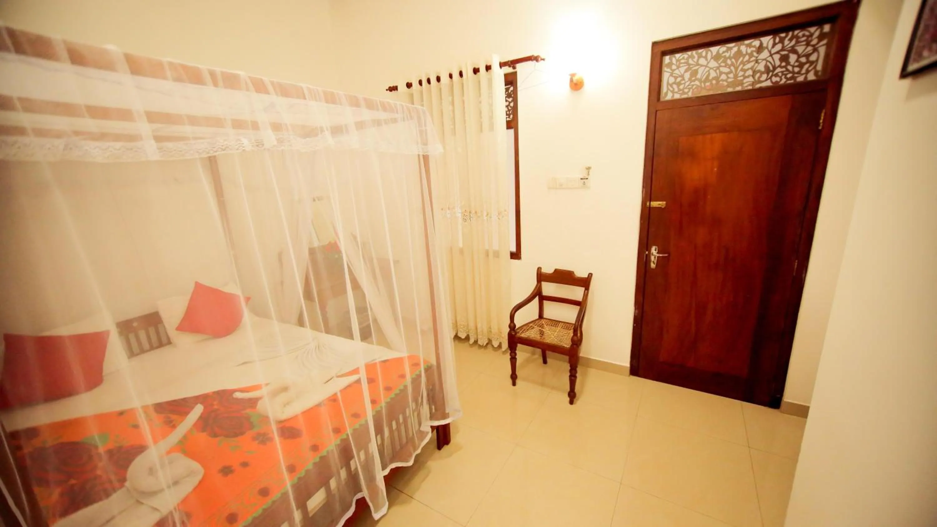 Bedroom in The Frangipani motel