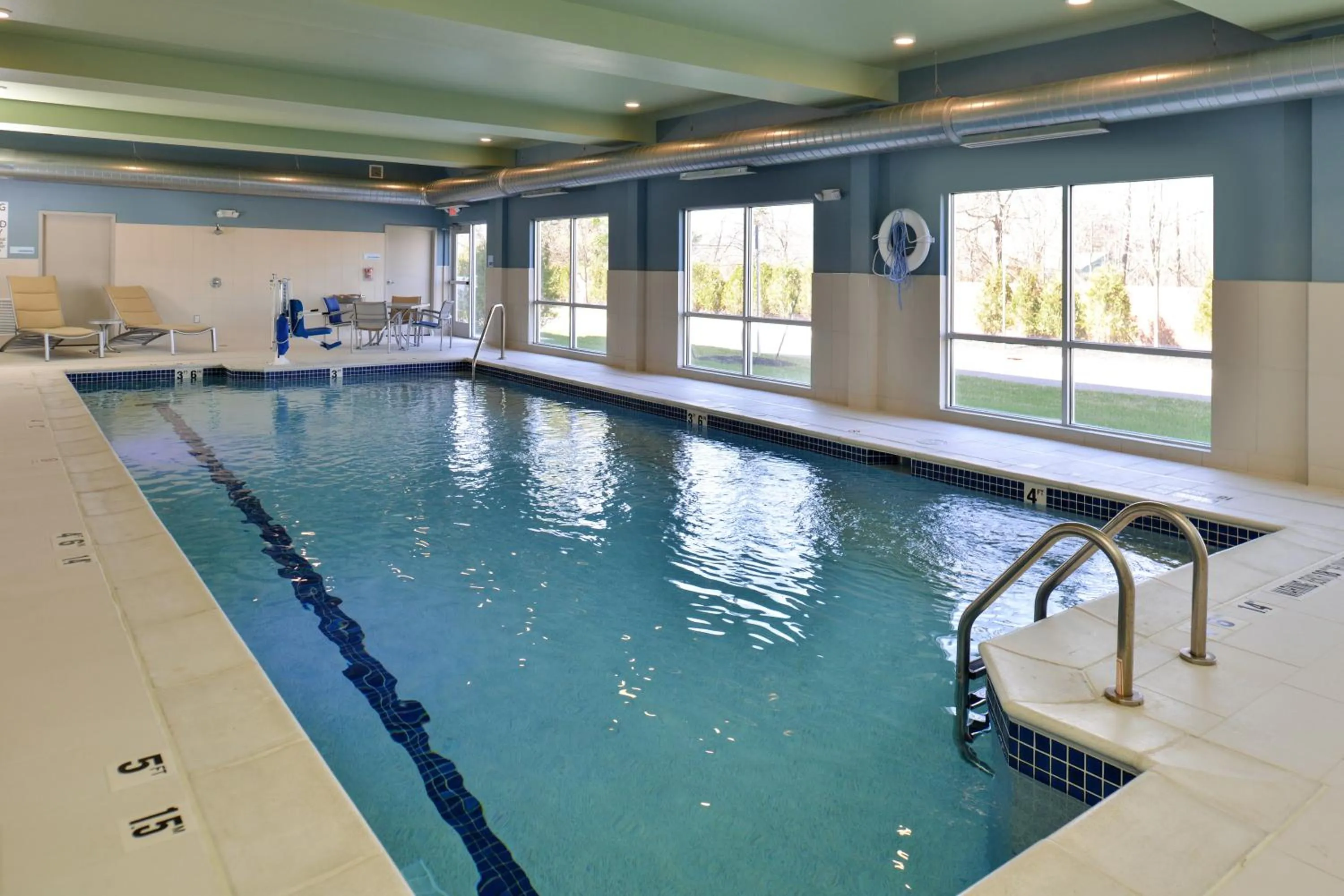 Swimming pool in Holiday Inn Express & Suites Farmington Hills - Detroit by IHG