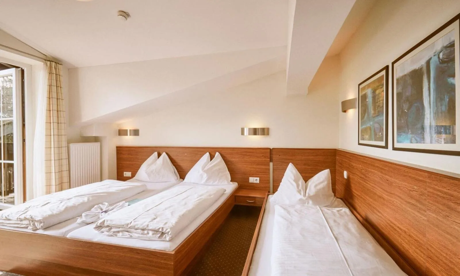 Bed in Hotel Pinzgauerhof by Alpeffect Hotels