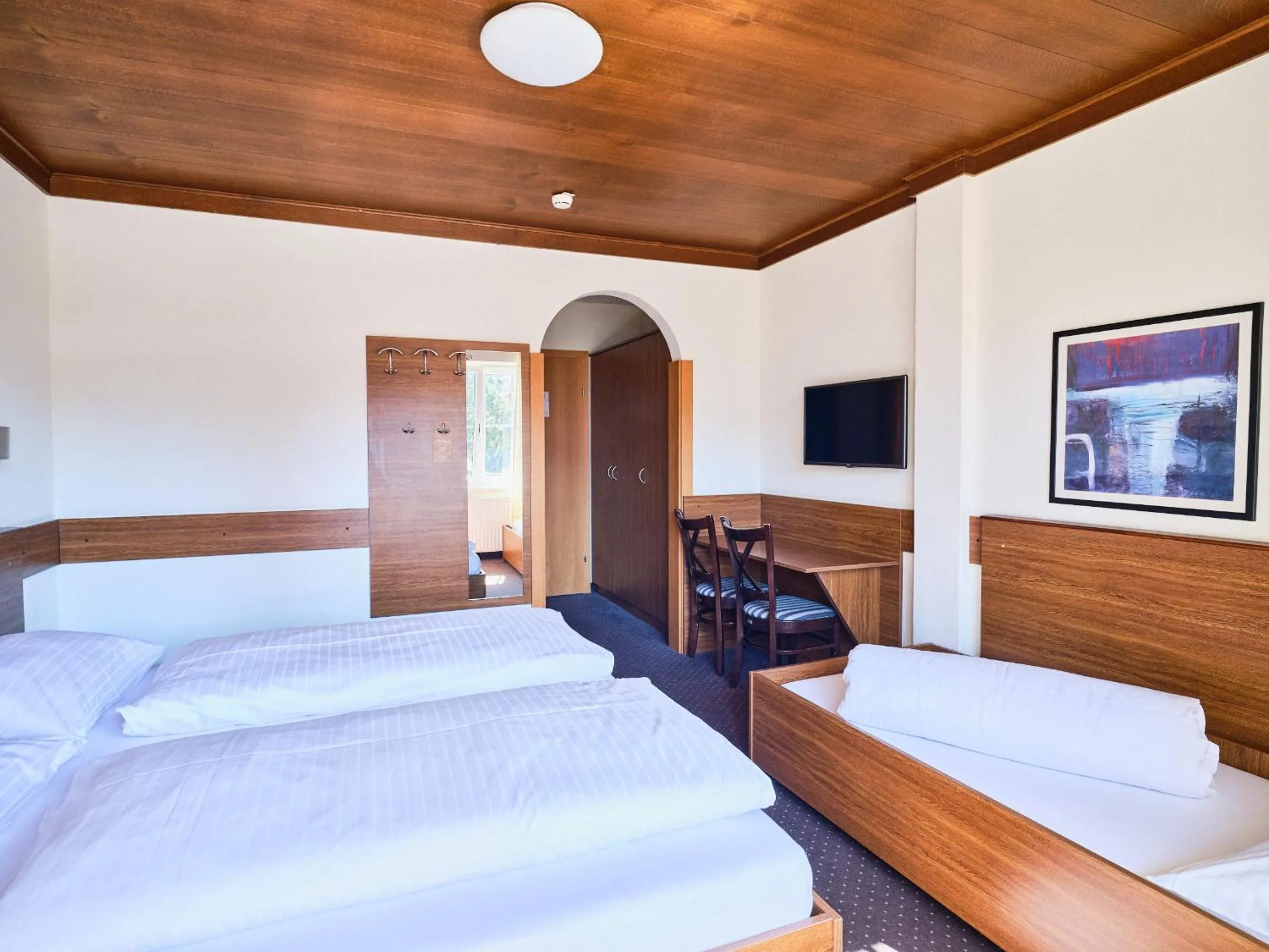 Photo of the whole room, Bed in Hotel Pinzgauerhof by Alpeffect Hotels