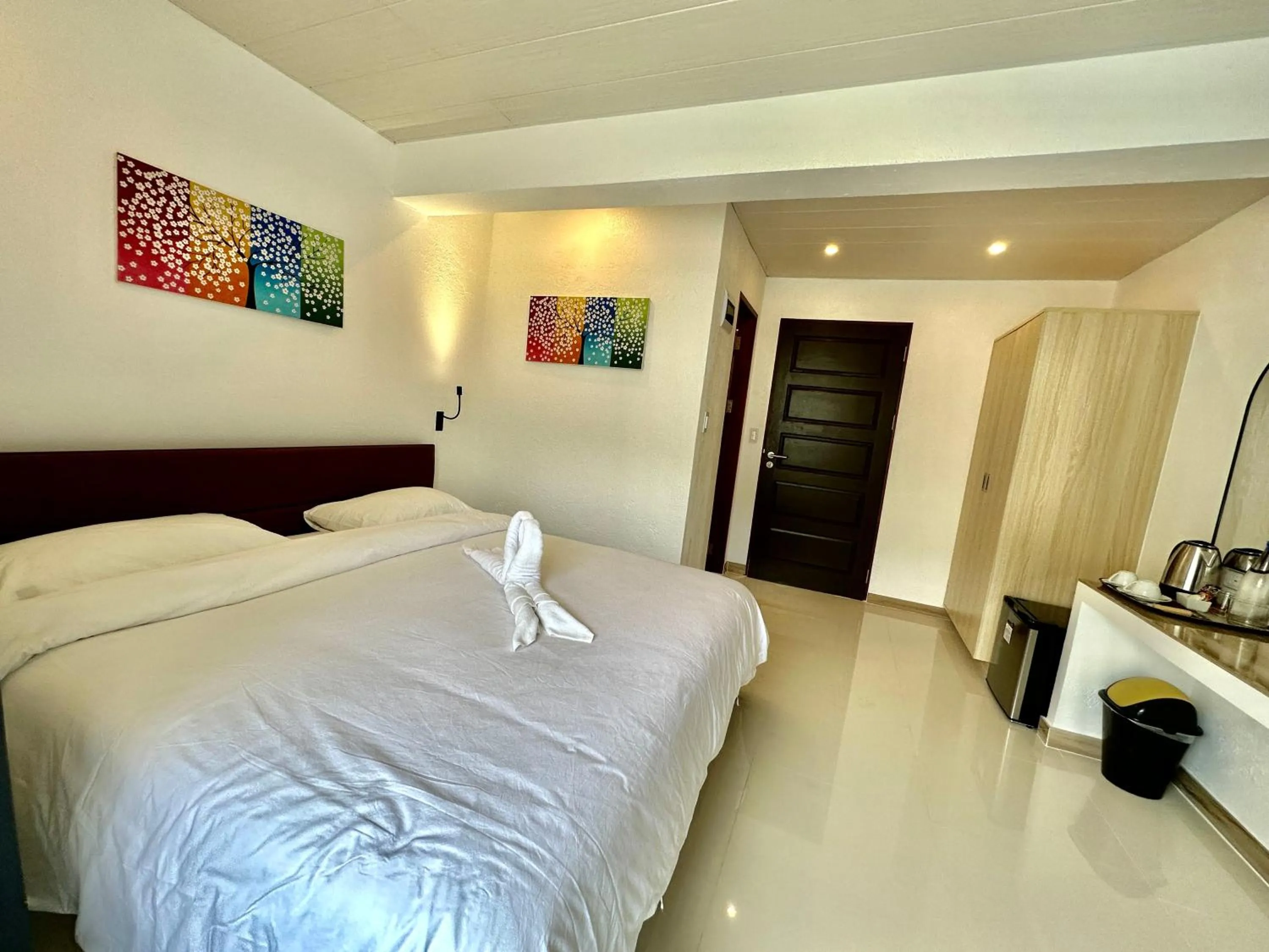 Bedroom, Bed in Calypso Beach and Dive Resort