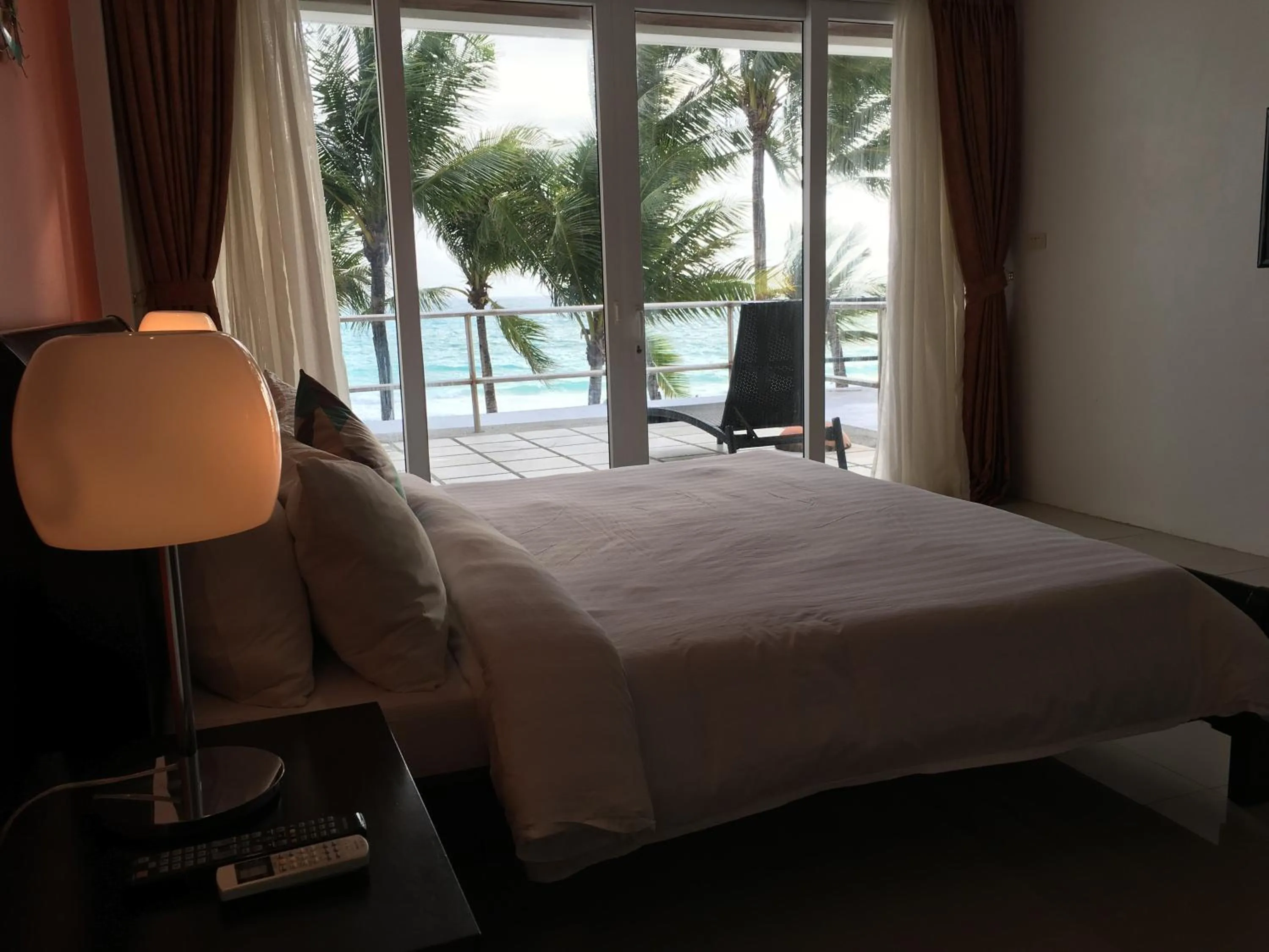 Balcony/Terrace, Bed in Calypso Beach and Dive Resort