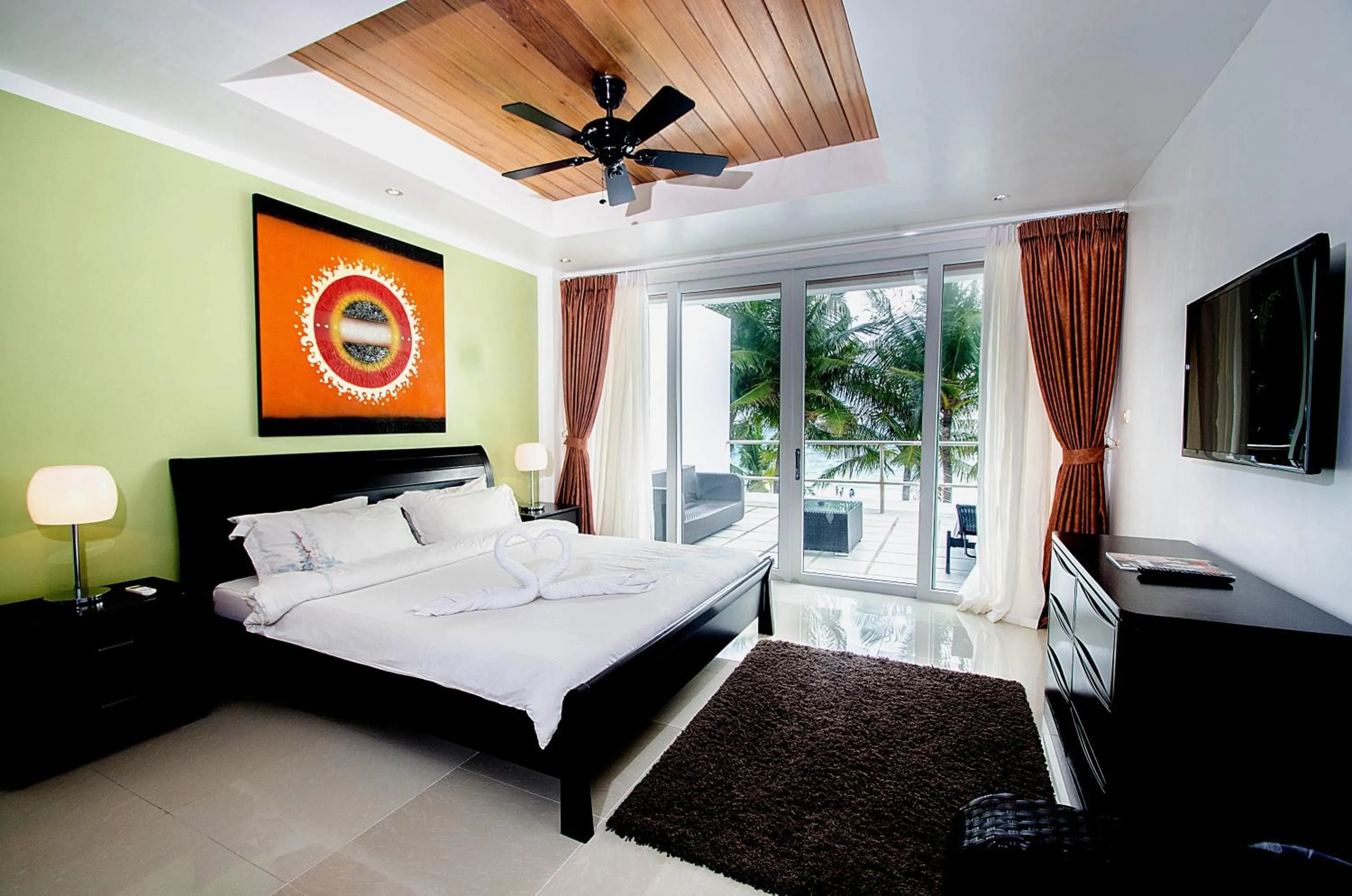 Photo of the whole room, Bed in Calypso Beach and Dive Resort