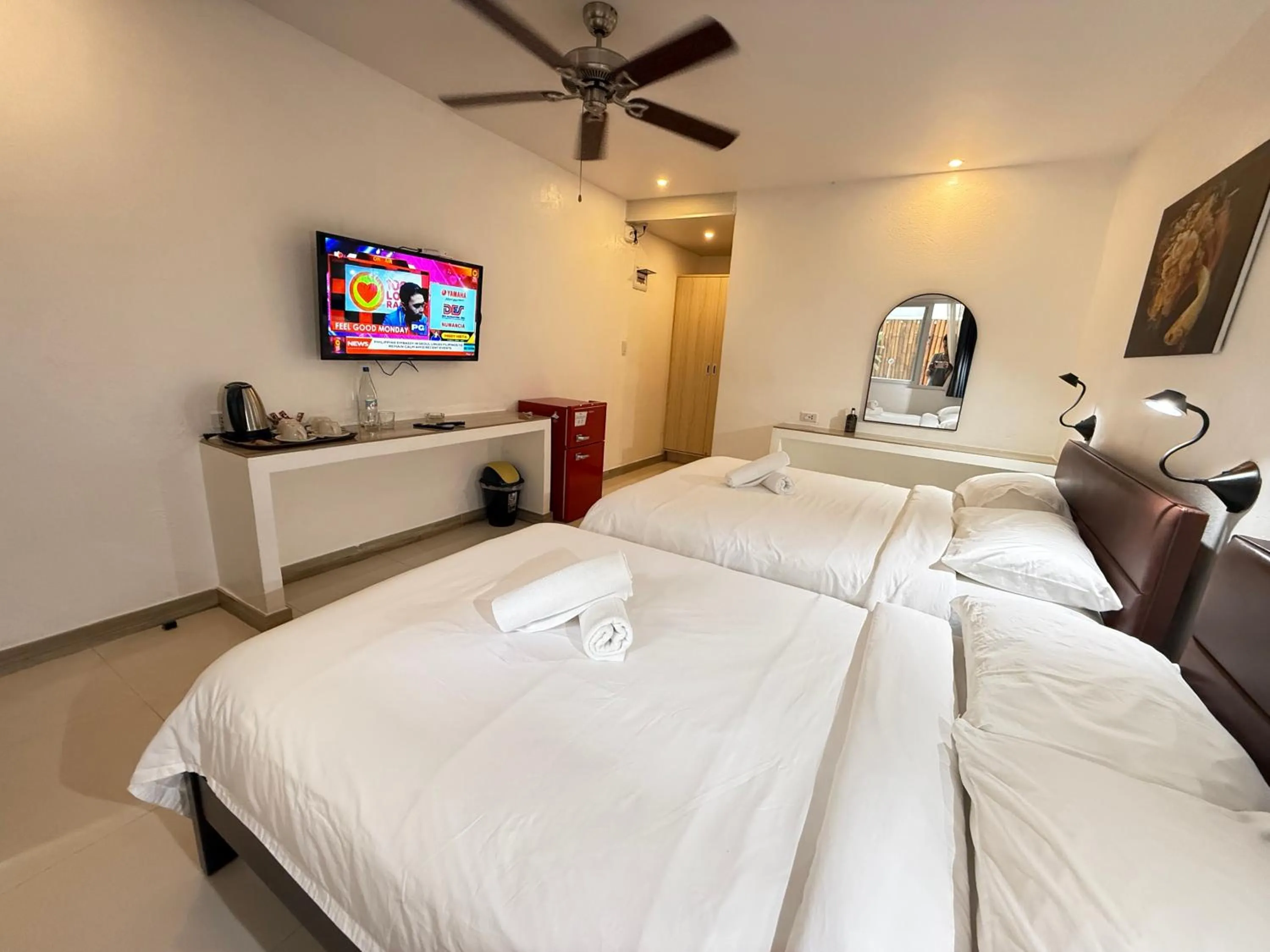 Photo of the whole room, Bed in Calypso Beach and Dive Resort