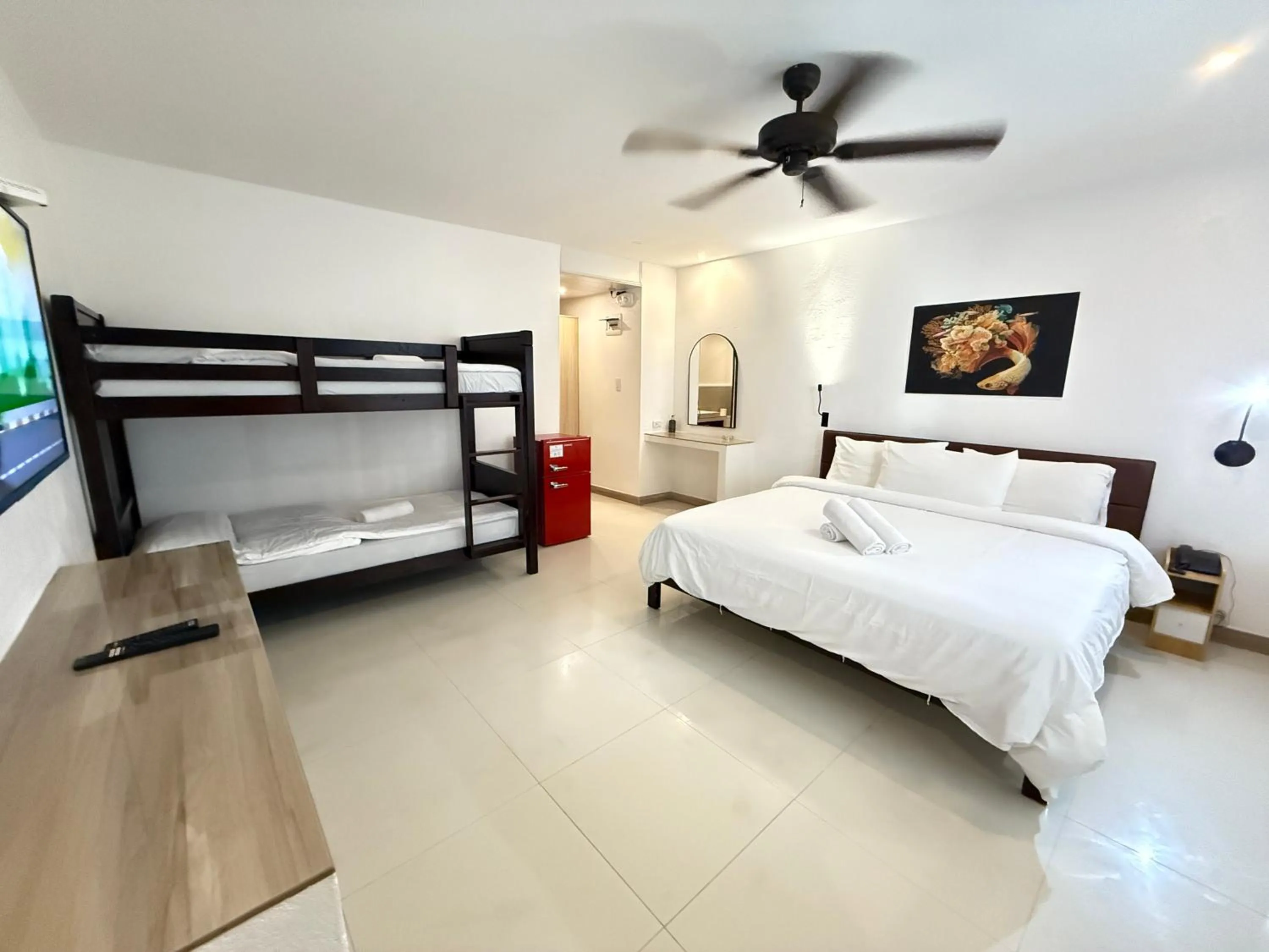 Photo of the whole room, Bed in Calypso Beach and Dive Resort