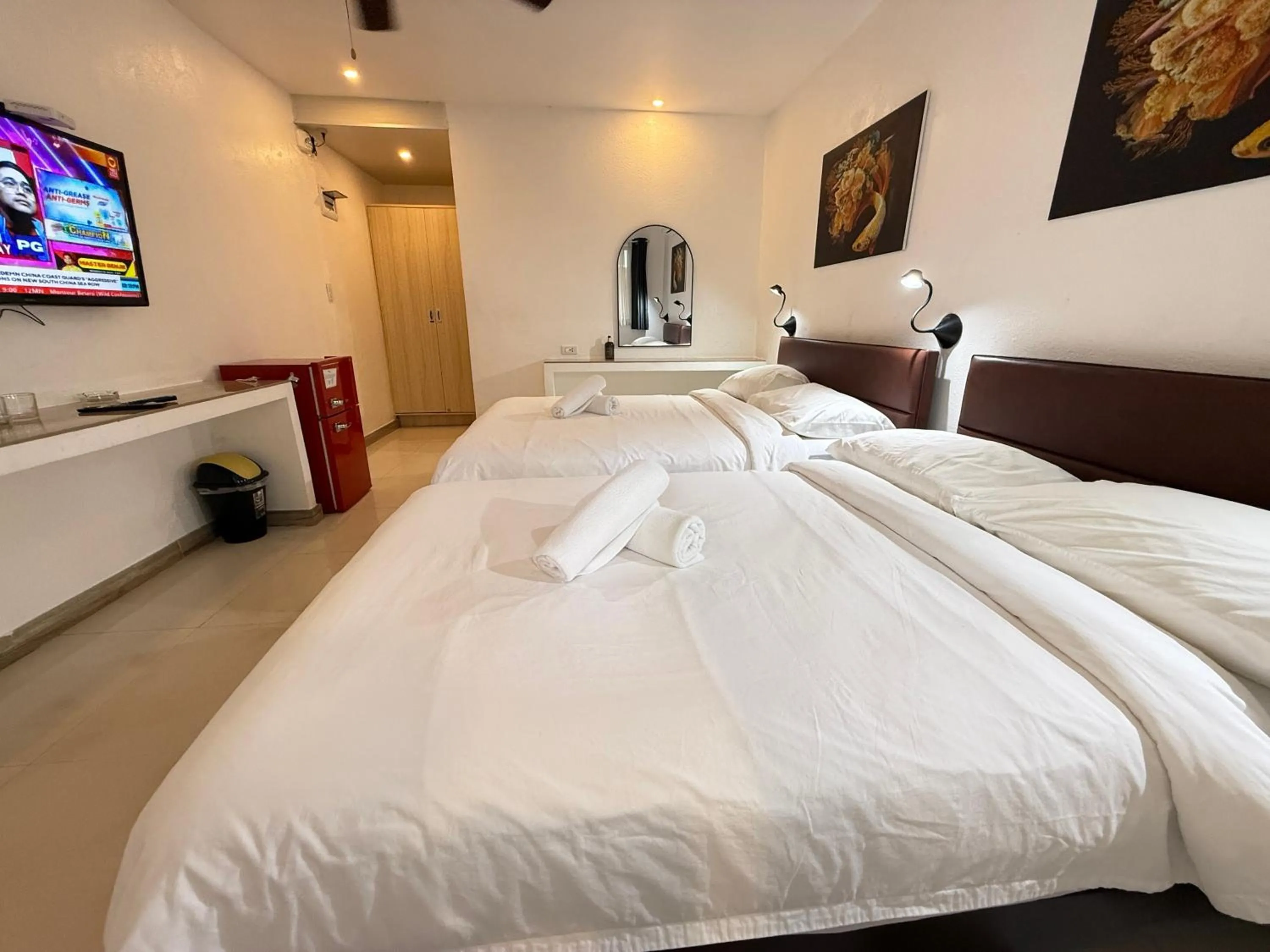 Bed in Calypso Beach and Dive Resort