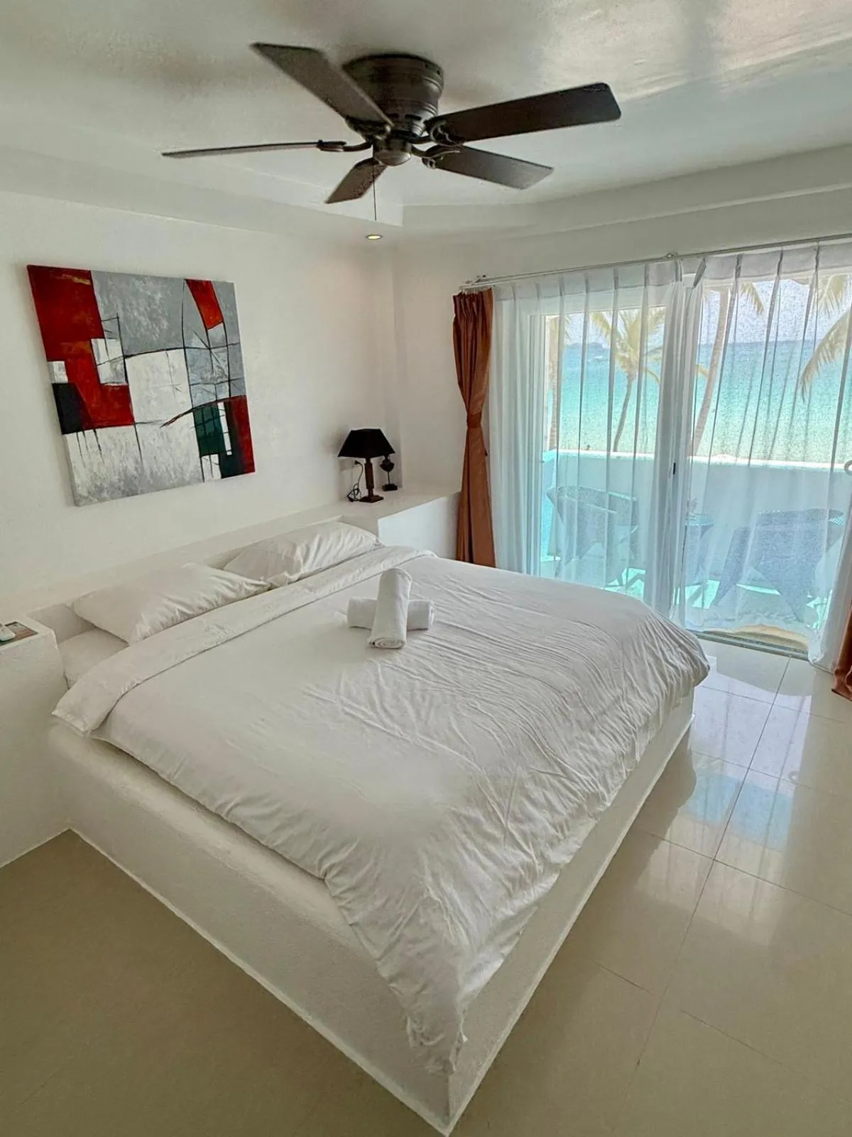 Bed in Calypso Beach and Dive Resort