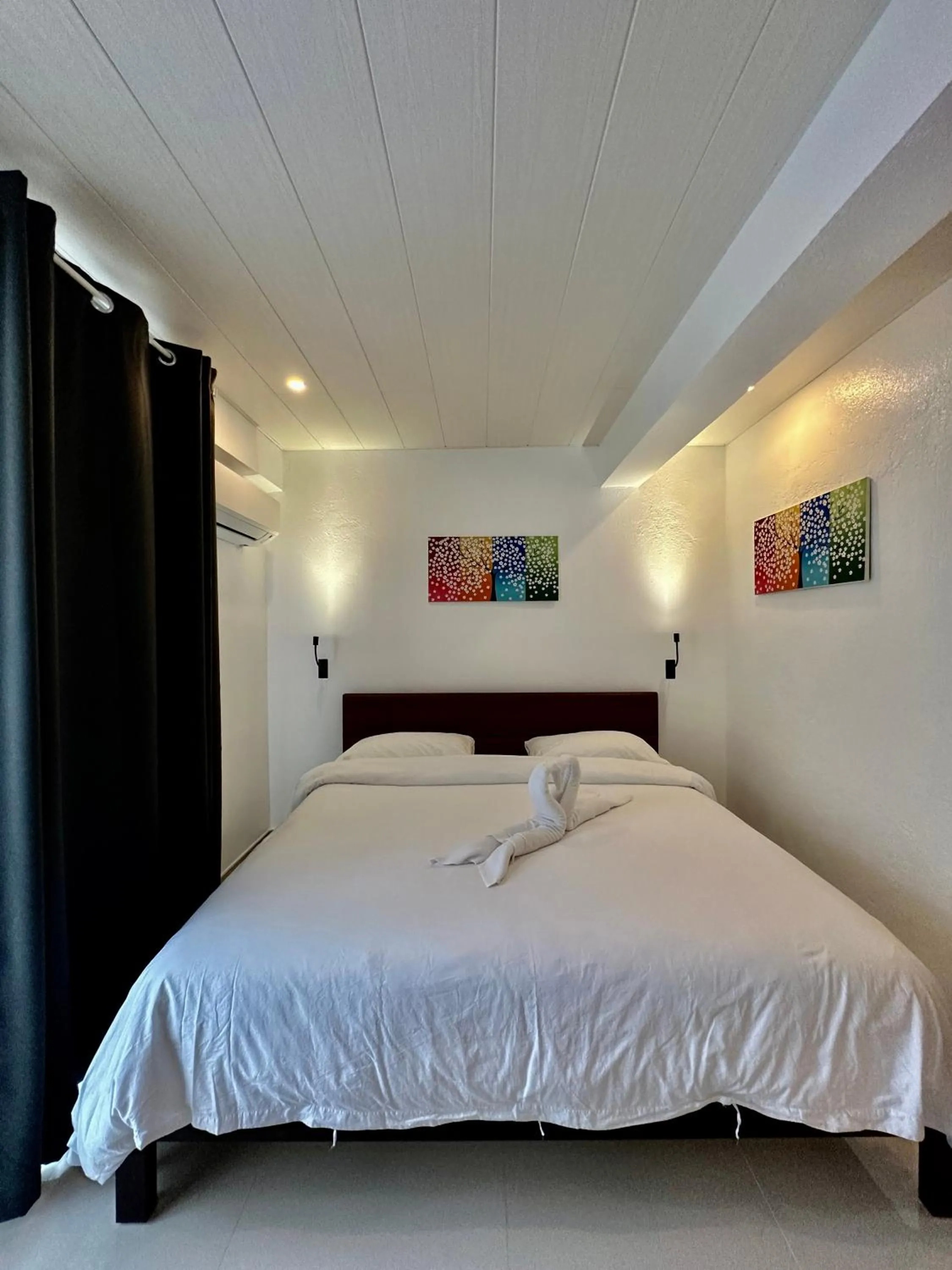 Bed in Calypso Beach and Dive Resort