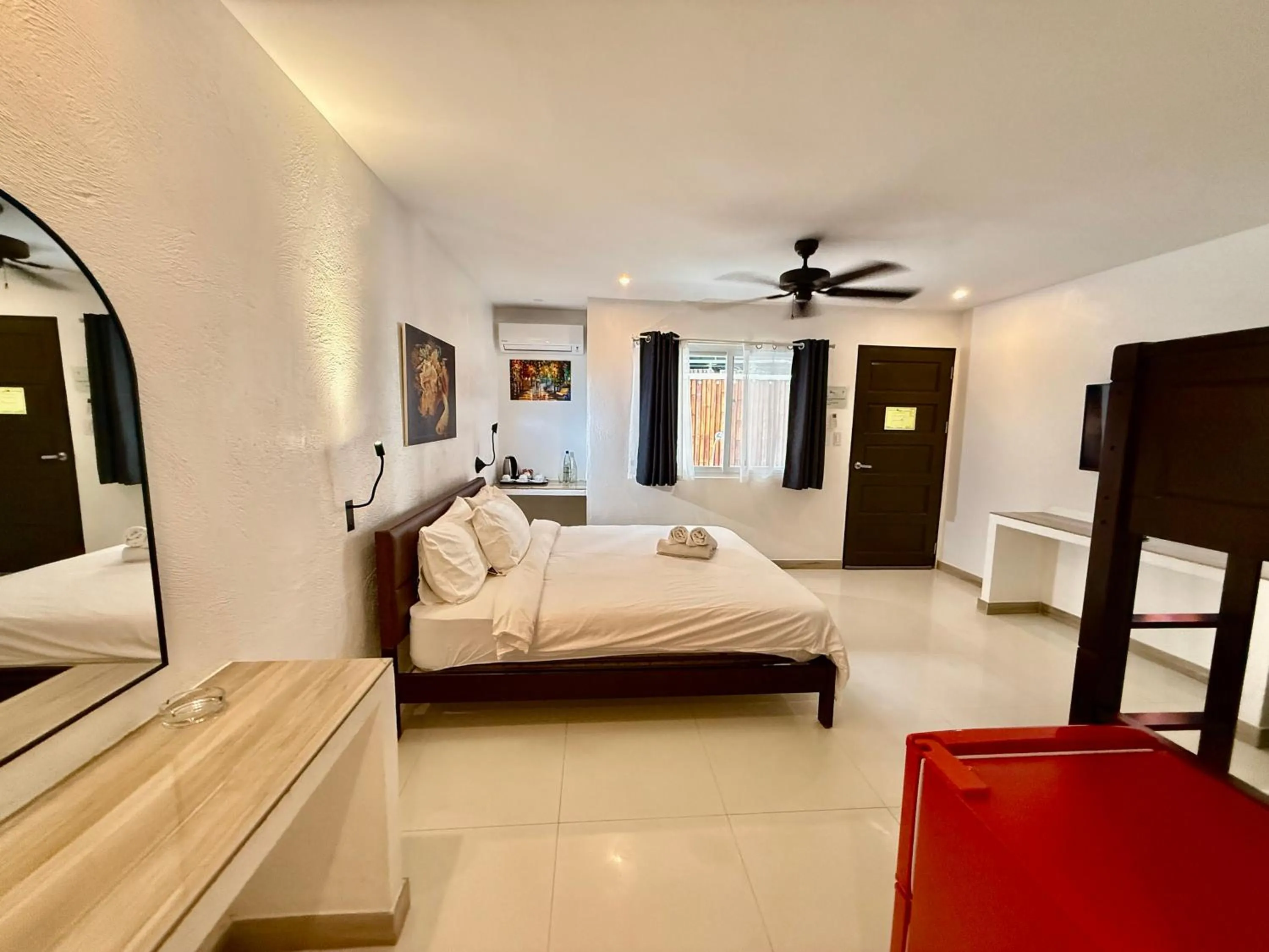 Photo of the whole room, Bed in Calypso Beach and Dive Resort