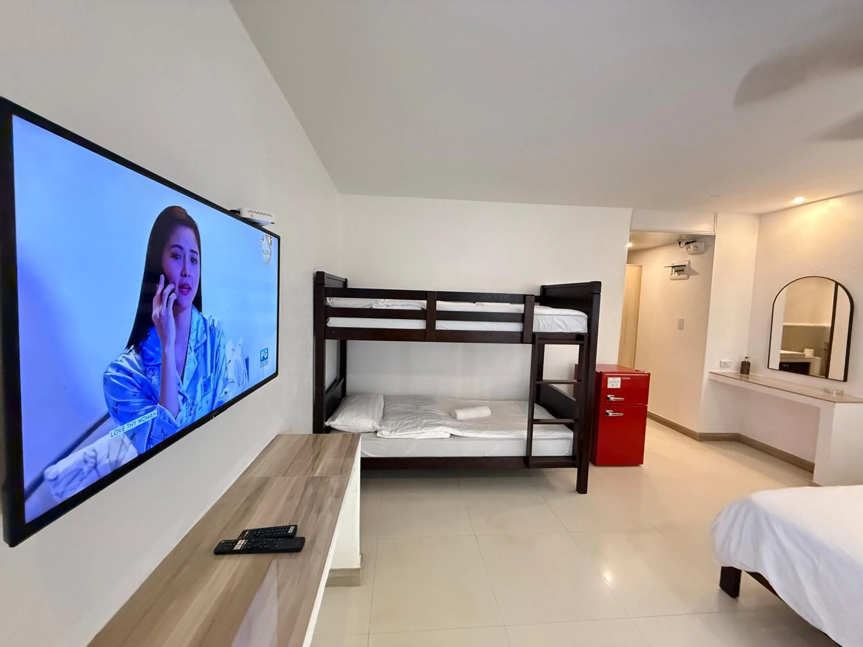 Photo of the whole room, Bed in Calypso Beach and Dive Resort