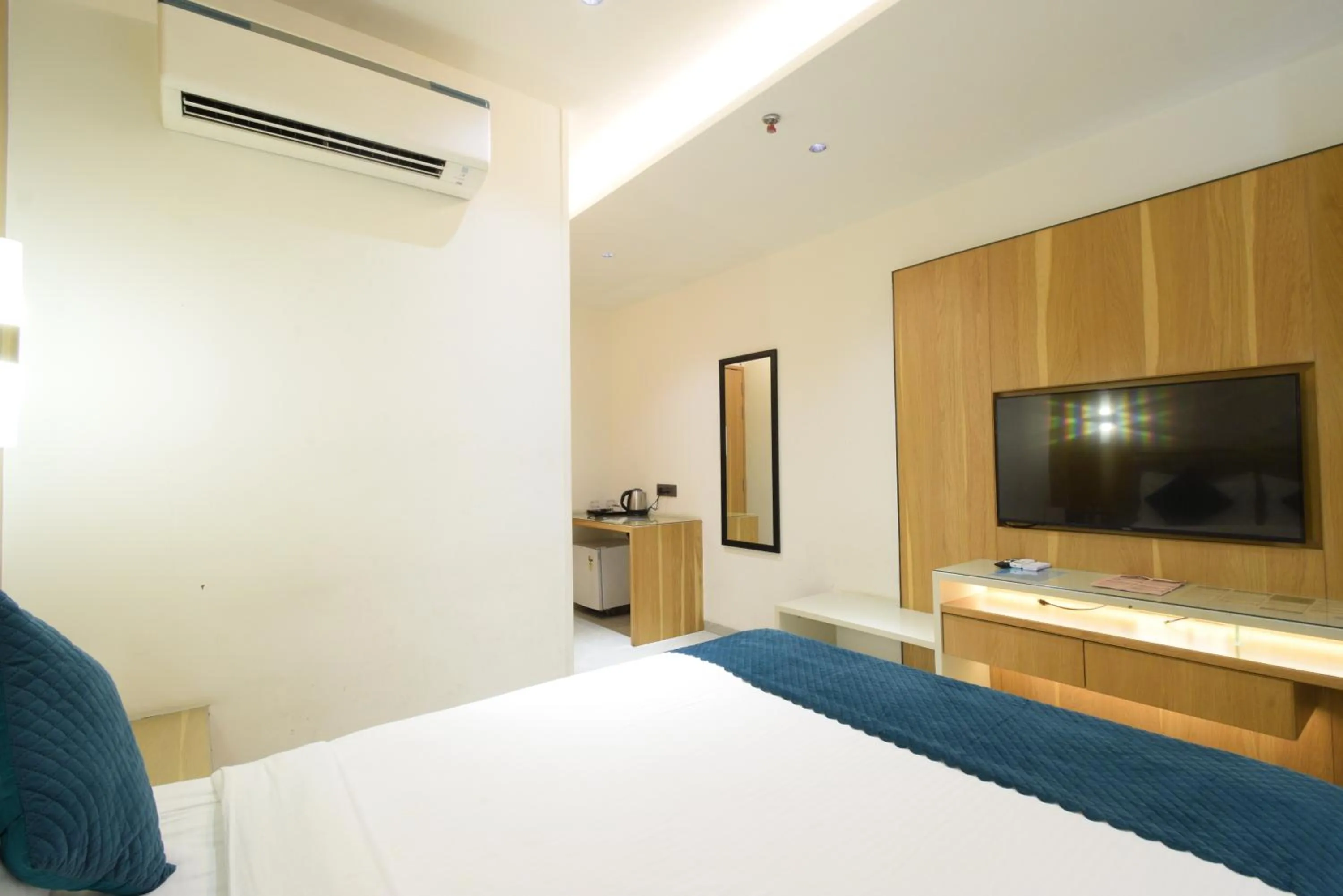 Photo of the whole room, Bed in Hotel TAAR TANGERINE Gachibowli