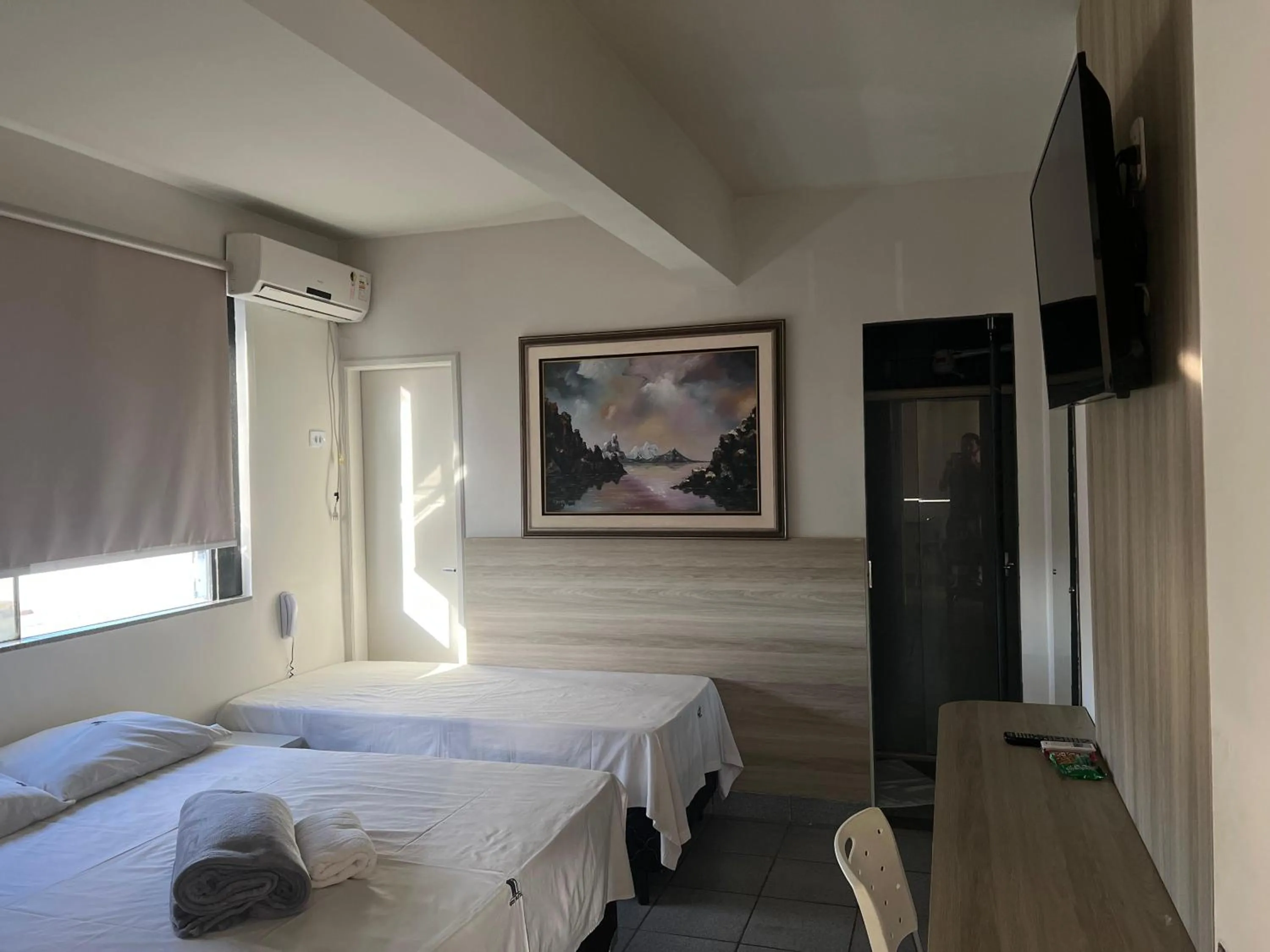 towels, Bed in Kris Hotel