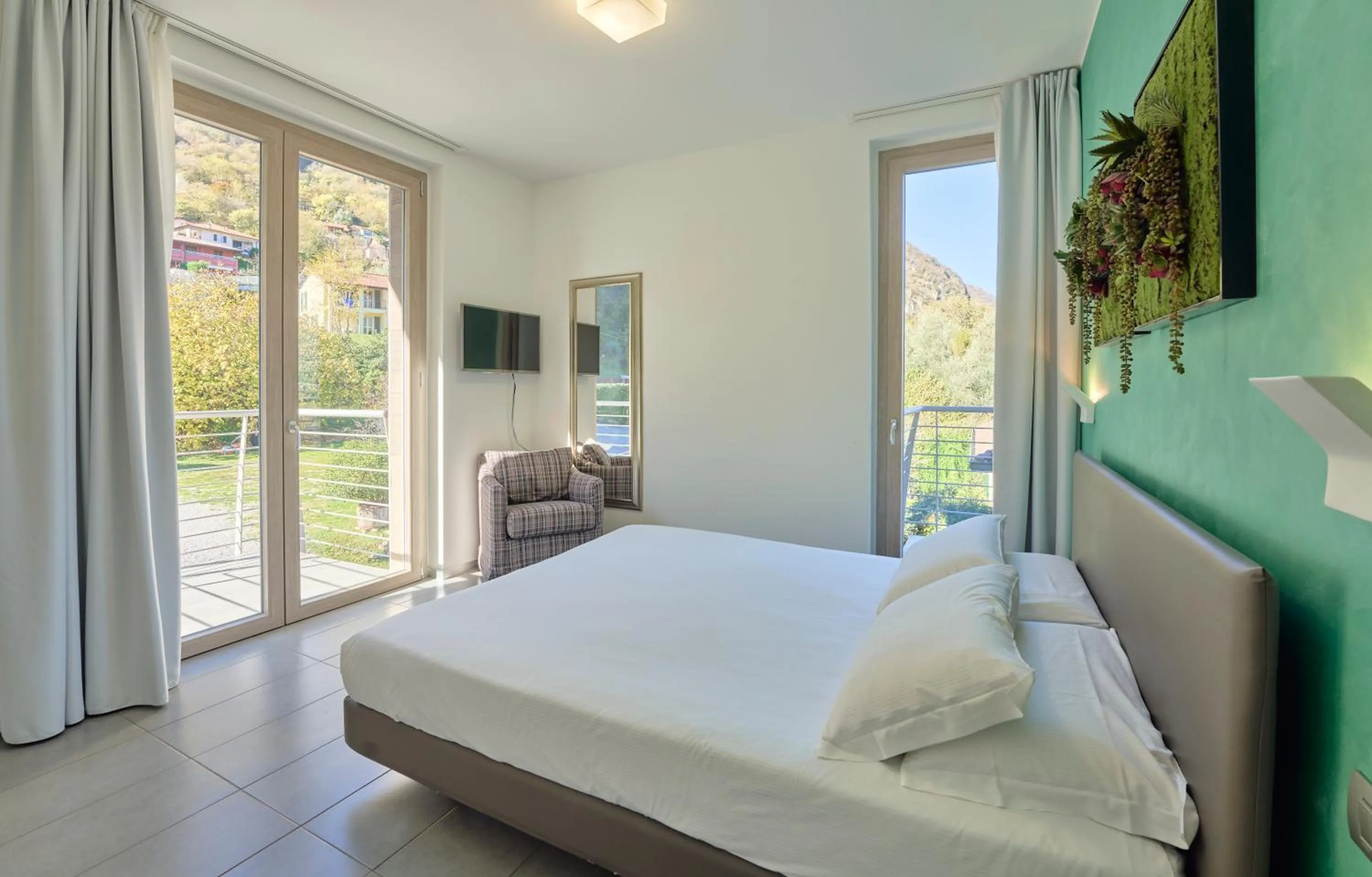 Bedroom, Bed in Bellagio Village - Holiday Apartments by the Lake - Seasonal Warm Pool and Sauna