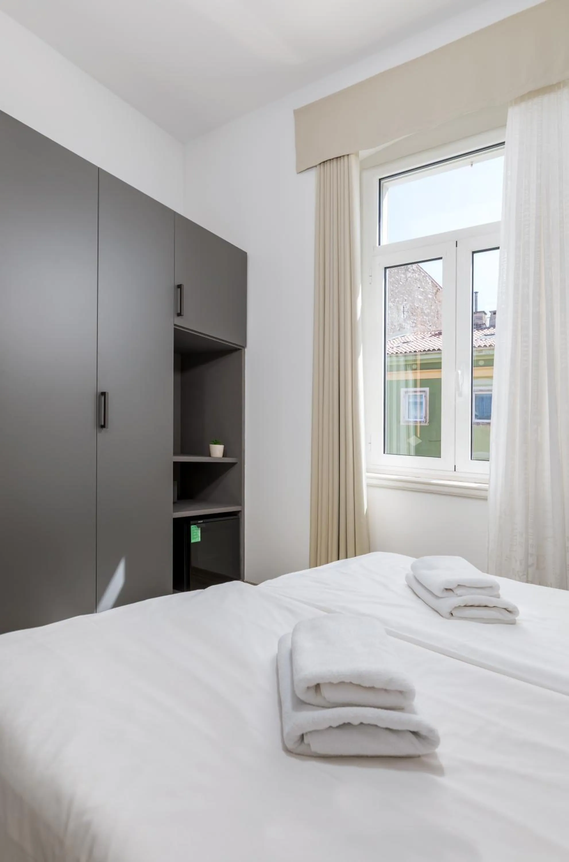 Photo of the whole room, Bed in Boutique Suites Joyce