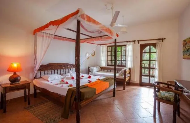 Bed in Lily Palm Resort