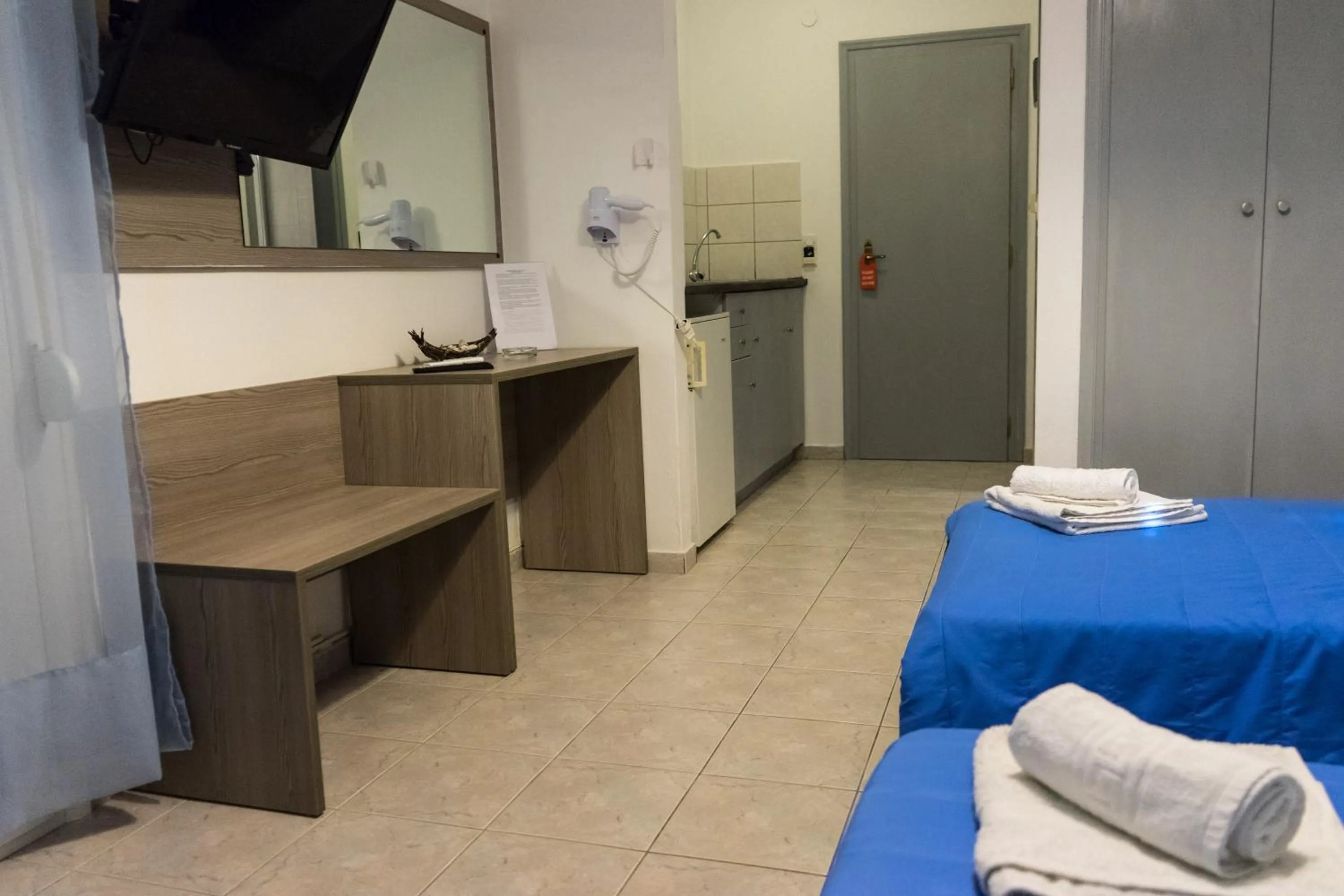 Bed in Polykratis Rooms