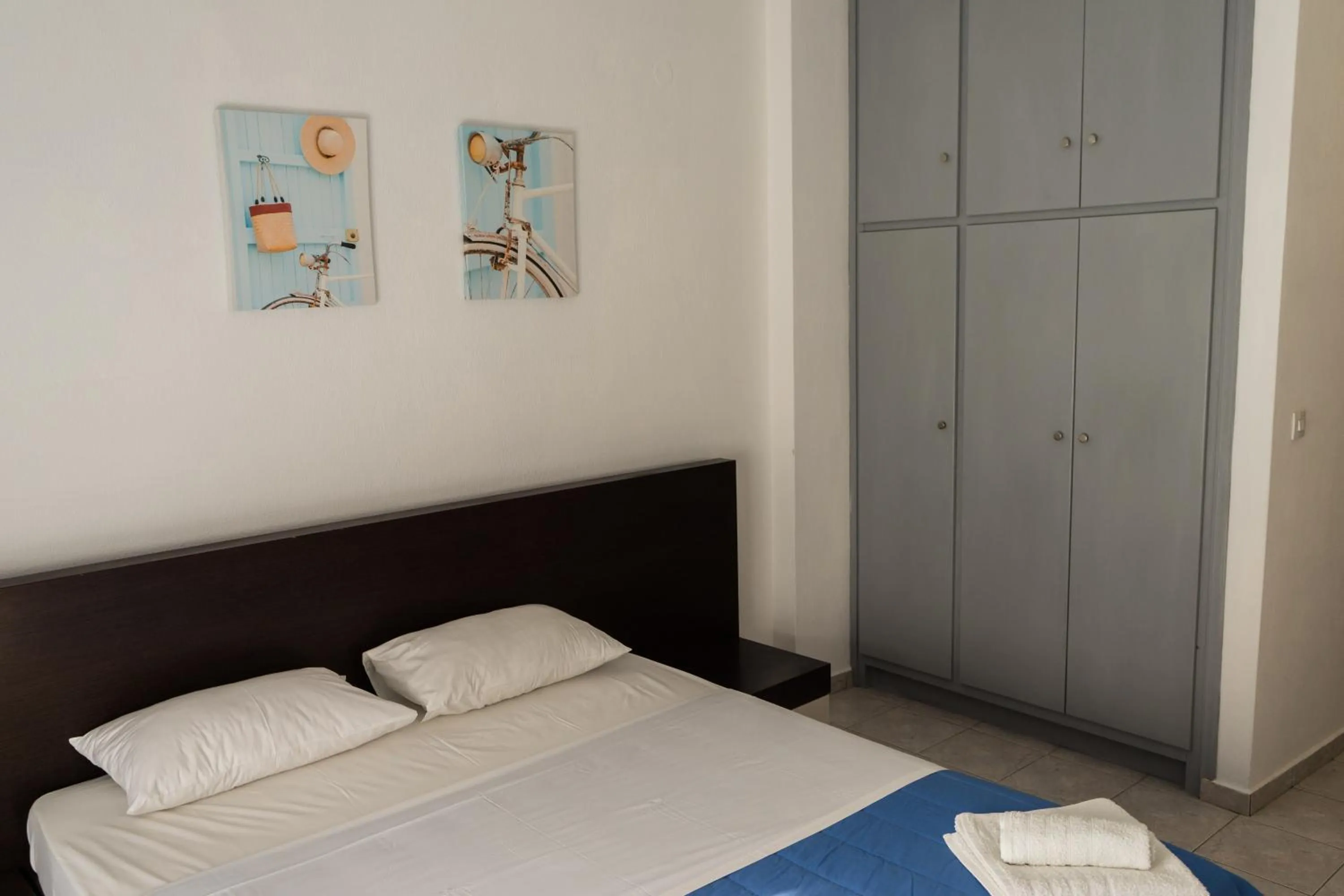 Bed in Polykratis Rooms